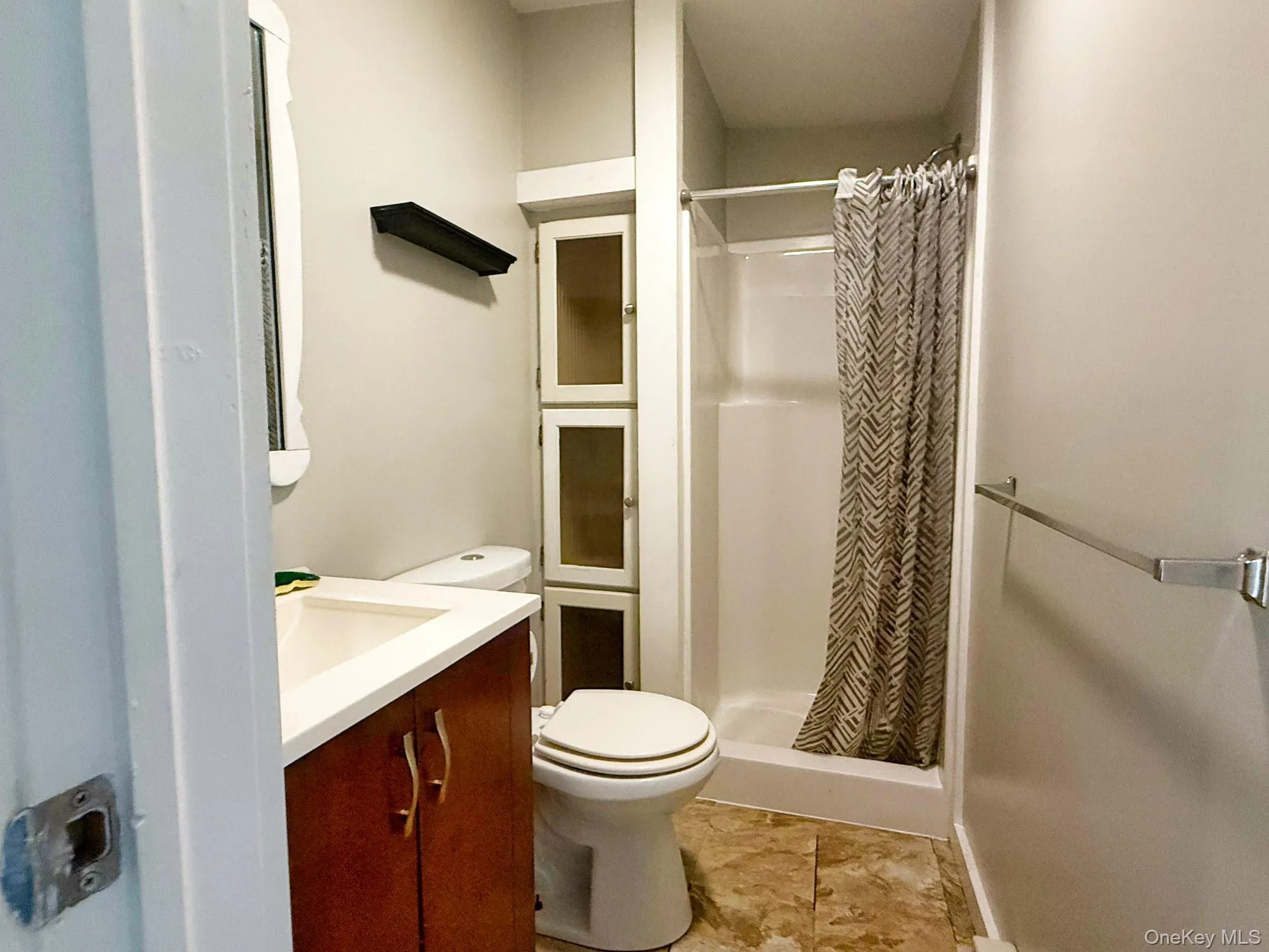 Full bathroom with vanity and a stall shower Full bathroom with vanity and a stall shower