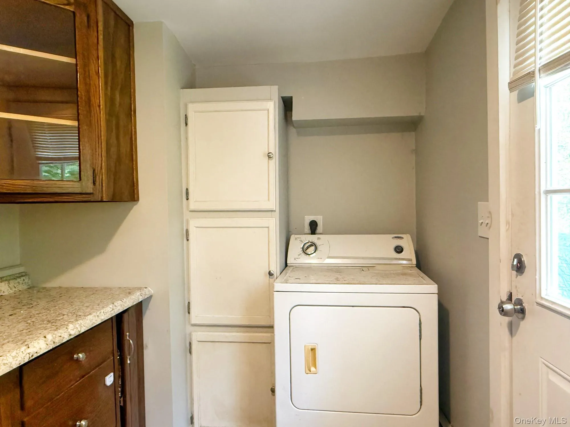 Laundry area featuring washer / dryer and cabinet space Laundry area featuring washer / dryer and cabinet space