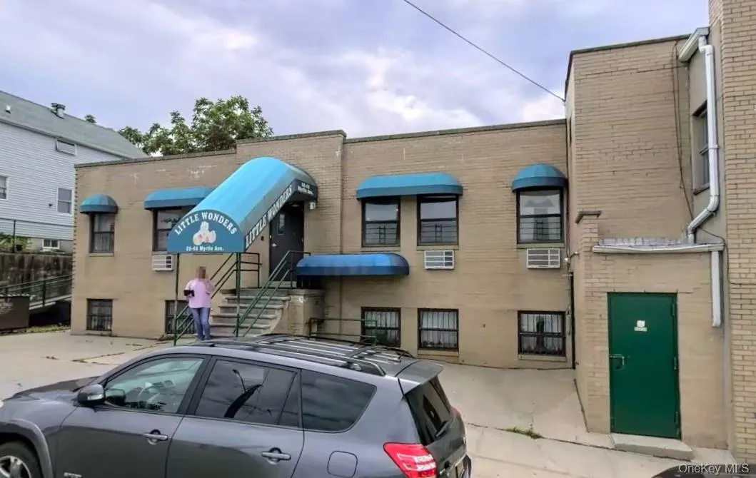 View of building exterior featuring cooling unit View of building exterior featuring cooling unit