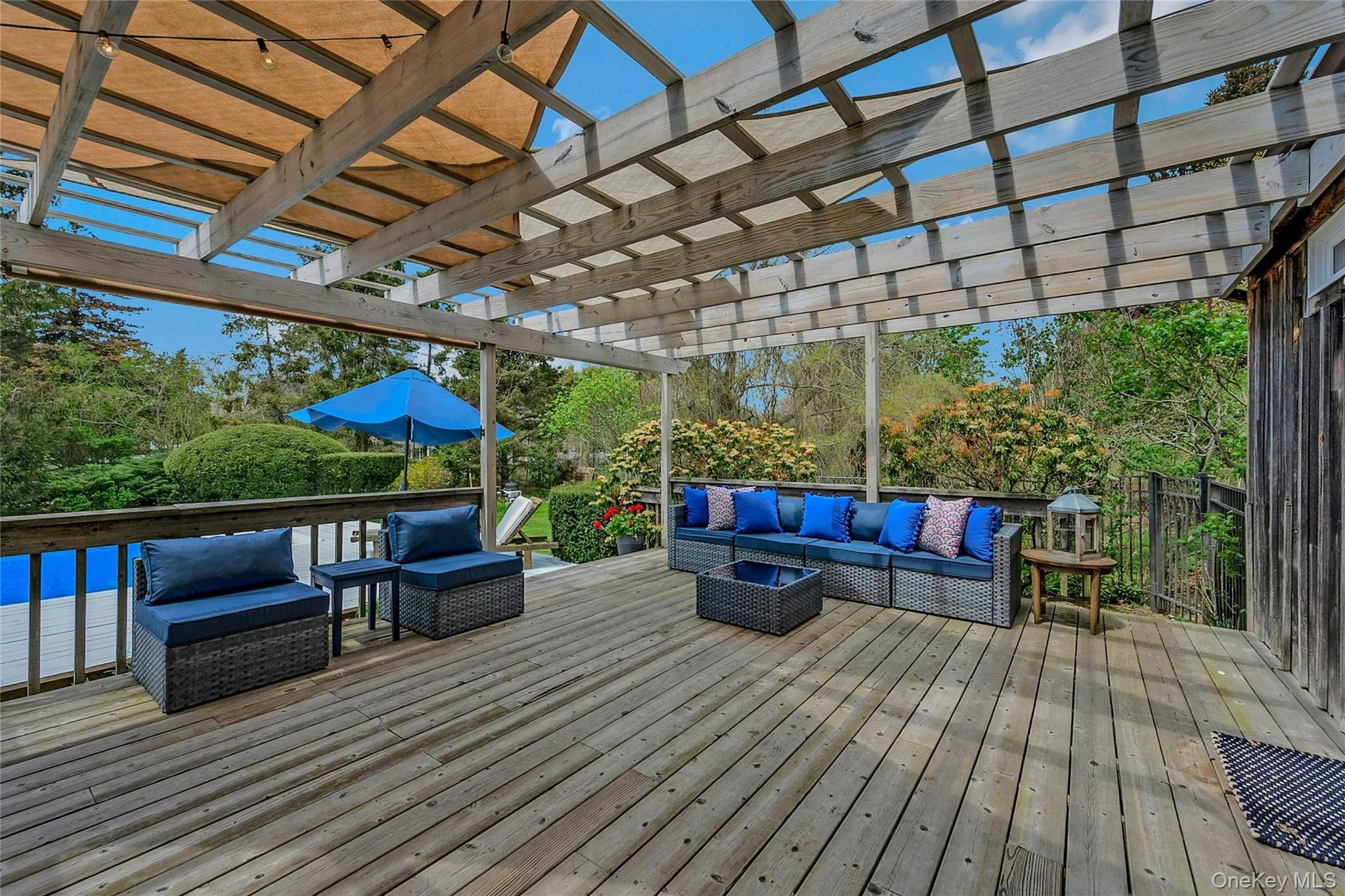 Deck featuring an outdoor living space and a pergola Deck featuring an outdoor living space and a pergola