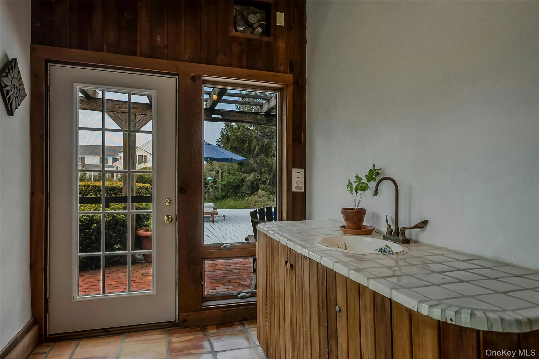 Doorway to outside with a sink Doorway to outside with a sink