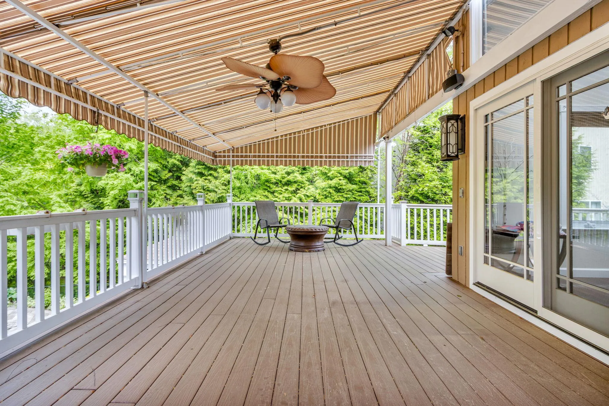 Wooden terrace featuring ceiling fan Wooden terrace featuring ceiling fan