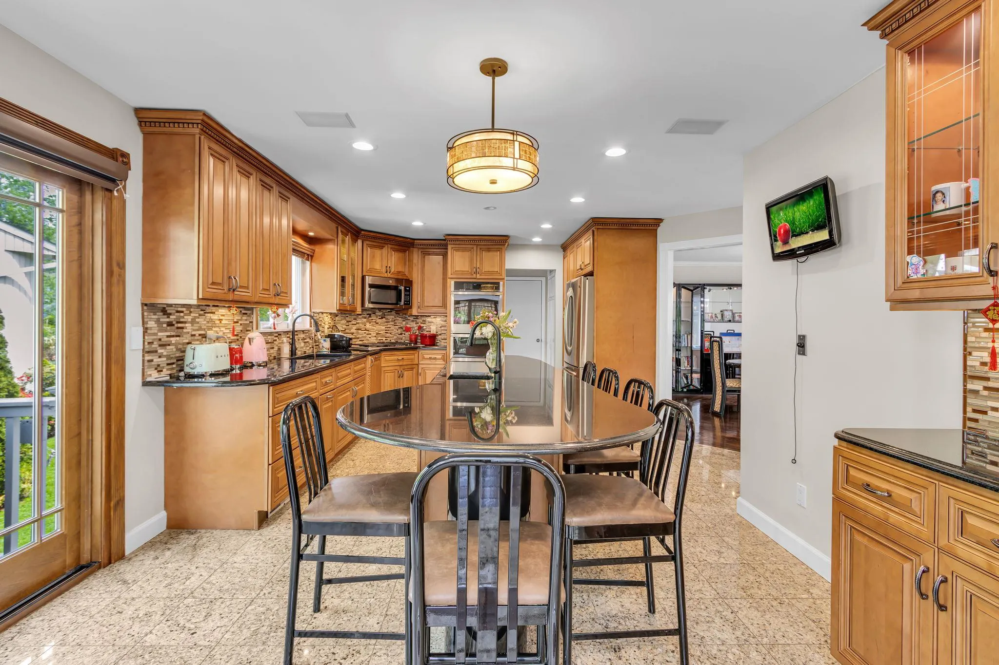 Dining room featuring baseboards, granite floors, and recessed lighting Dining room featuring baseboards, granite floors, and recessed lighting