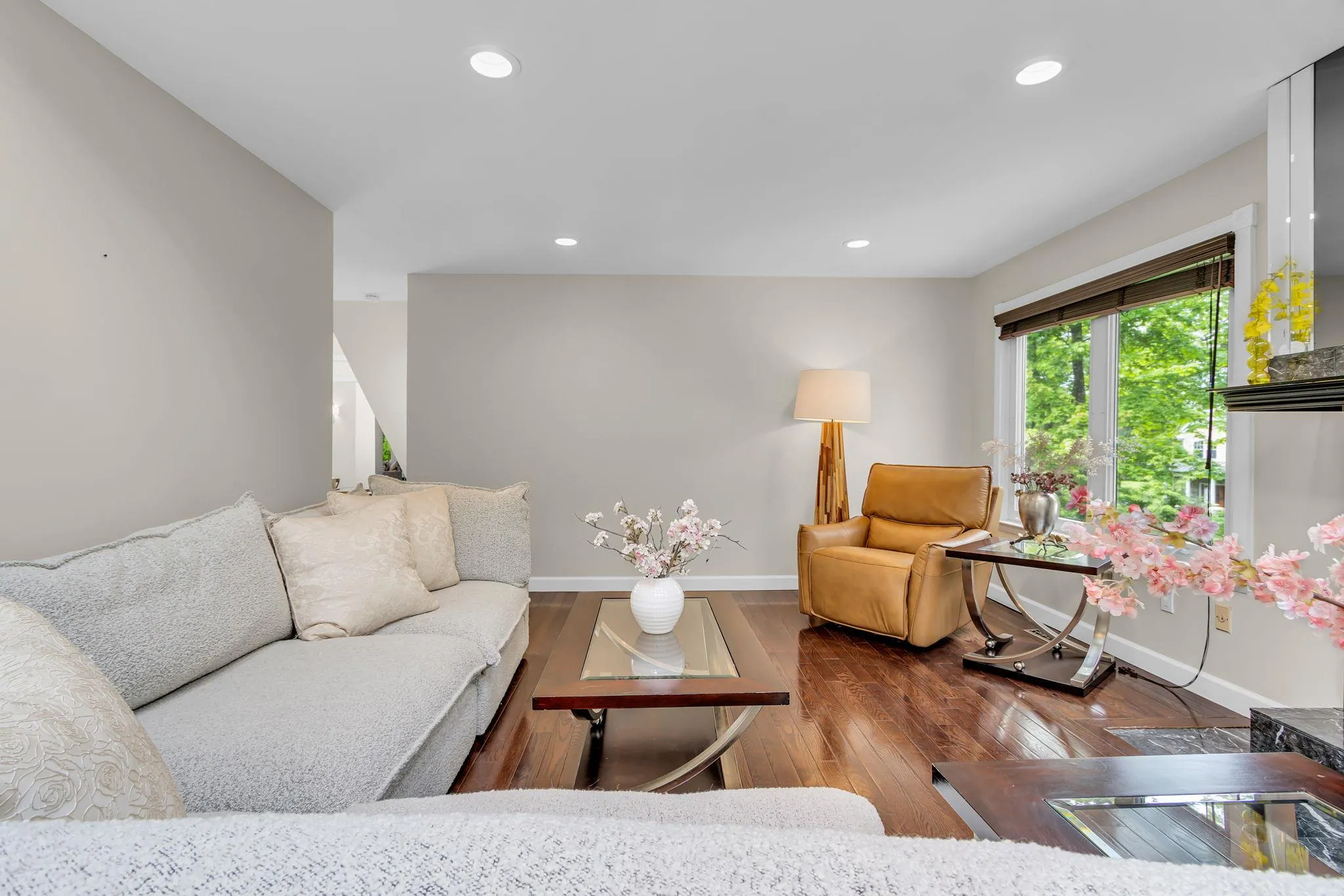 Living room with baseboards, hardwood / wood-style flooring, and recessed lighting Living room with baseboards, hardwood / wood-style flooring, and recessed lighting