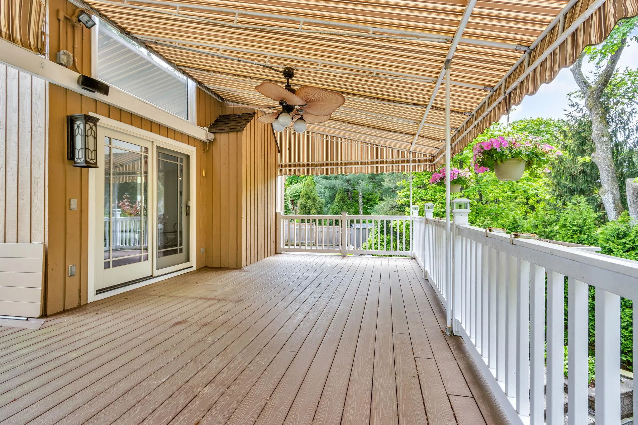 Wooden deck featuring ceiling fan Wooden deck featuring ceiling fan