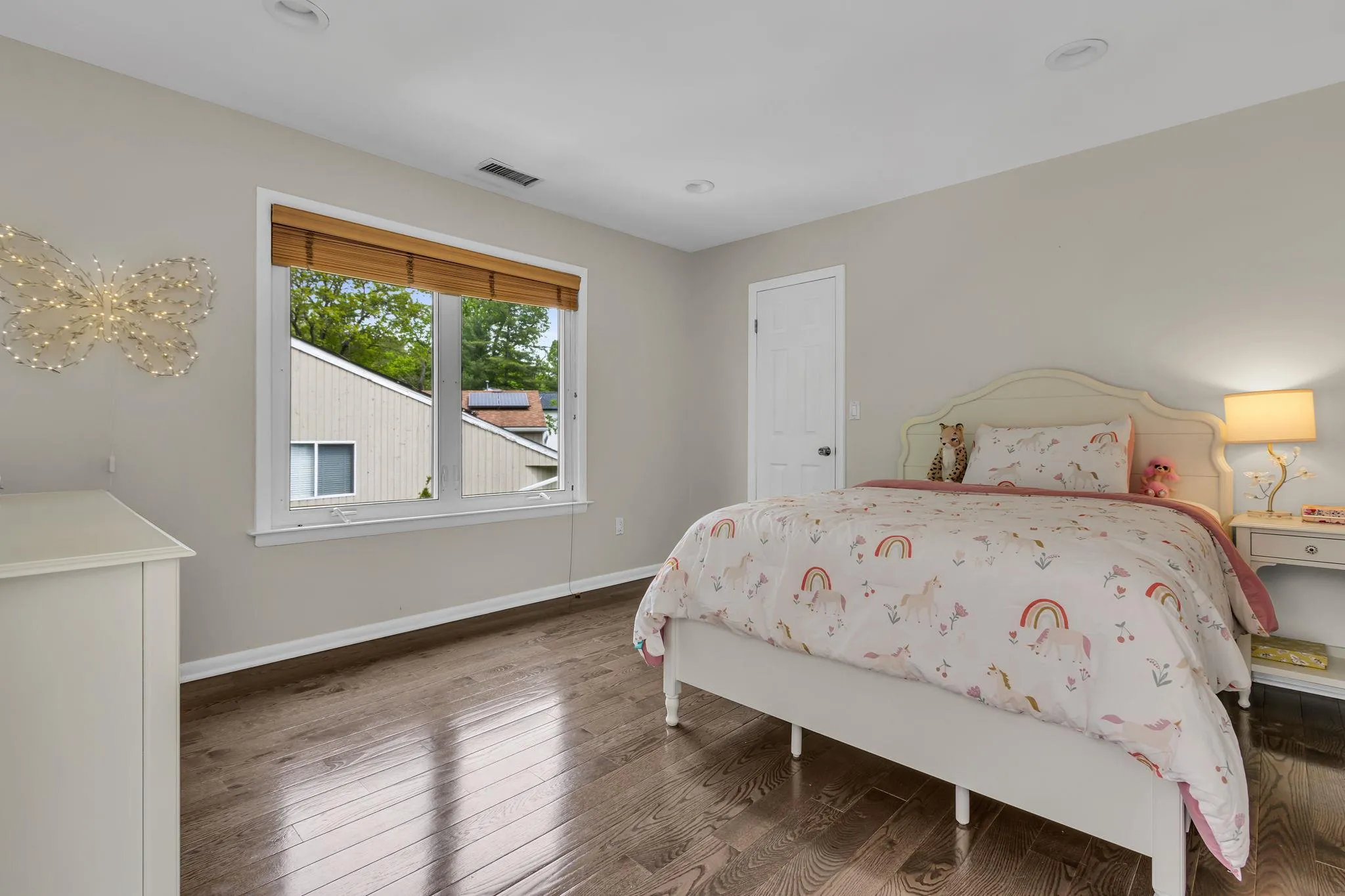 Bedroom with wood finished floors, baseboards, and recessed lighting Bedroom with wood finished floors, baseboards, and recessed lighting