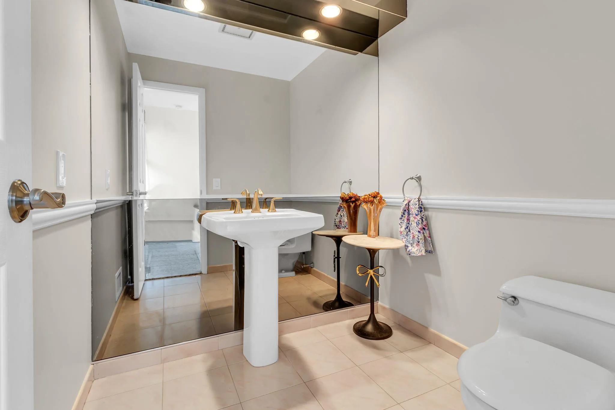 Bathroom with toilet, baseboards, and tile patterned floors Bathroom with toilet, baseboards, and tile patterned floors