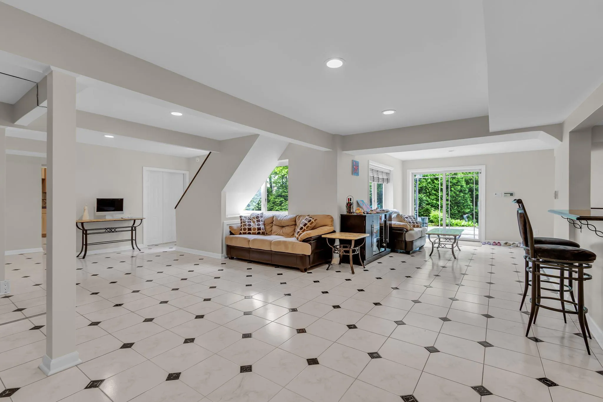 Living room with healthy amount of natural light, recessed lighting, and baseboards Living room with healthy amount of natural light, recessed lighting, and baseboards