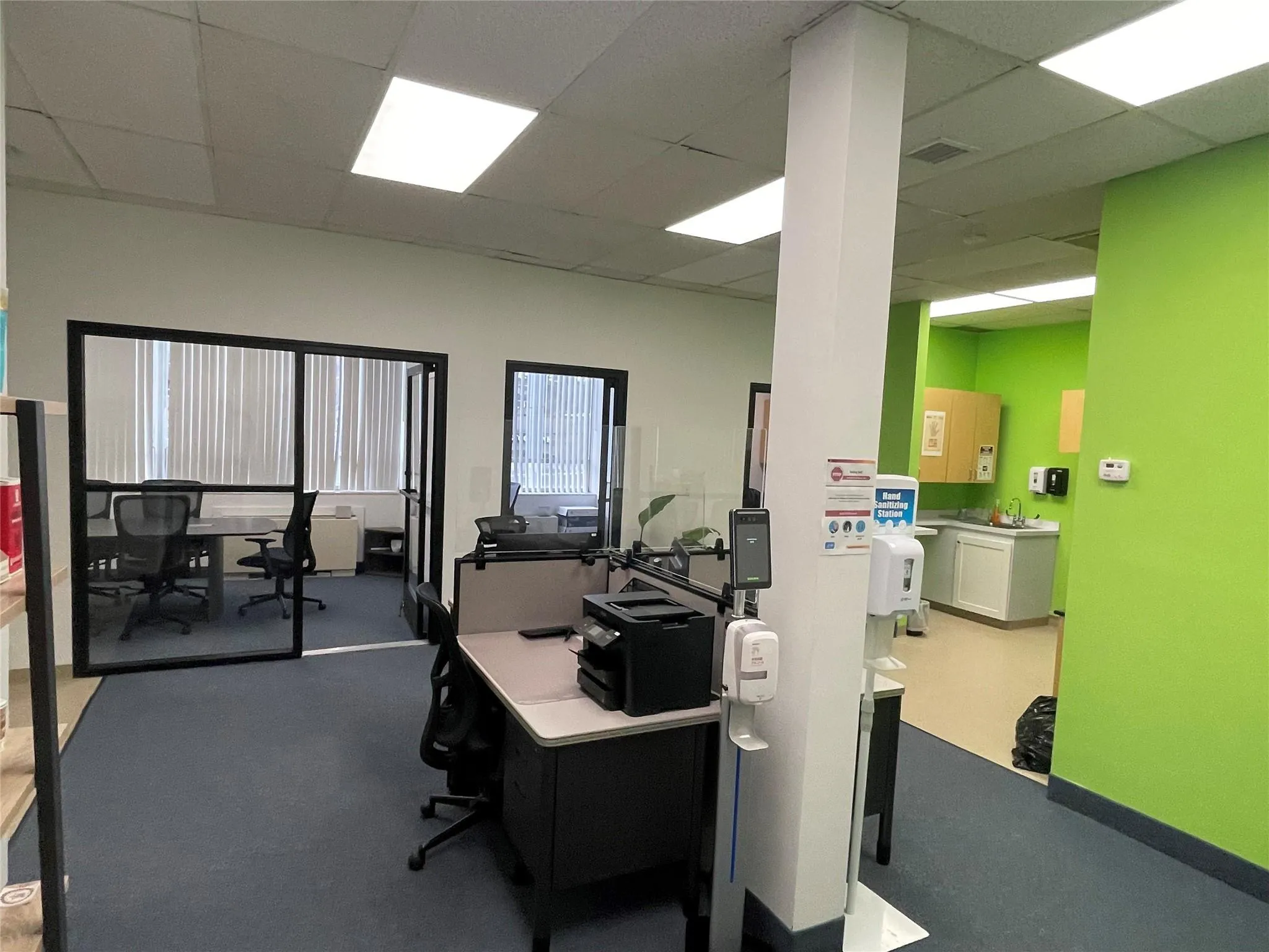 Home office with a paneled ceiling Home office with a paneled ceiling