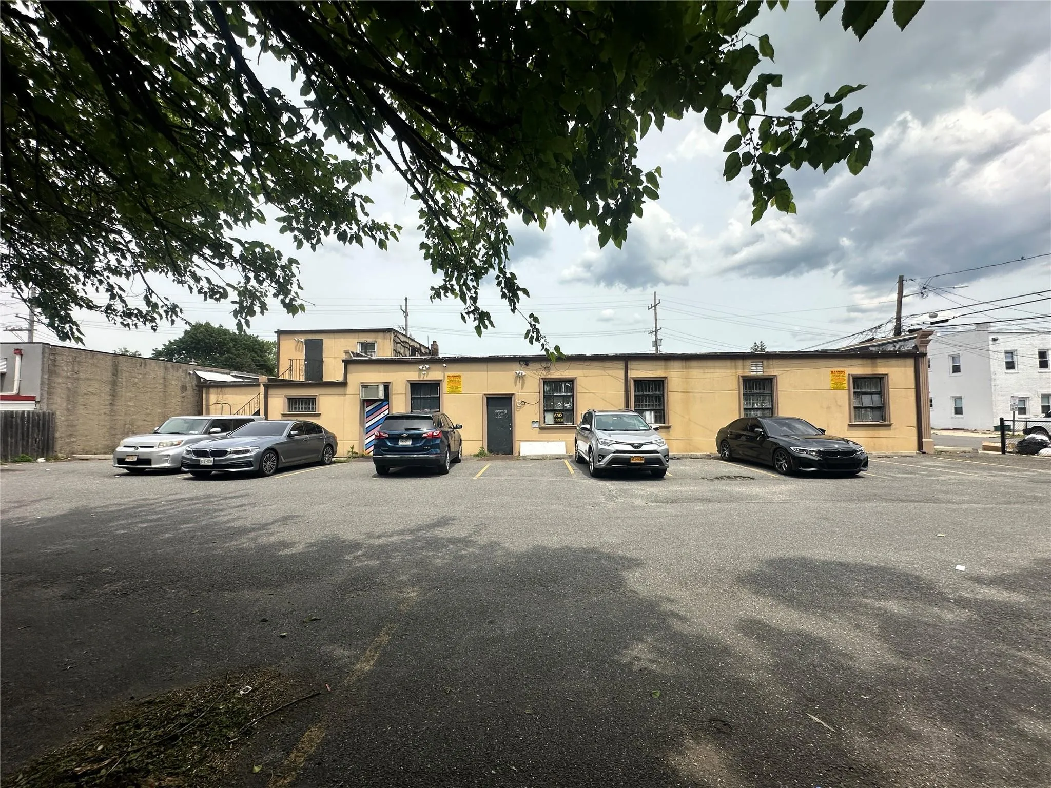 View of property featuring uncovered parking View of property featuring uncovered parking