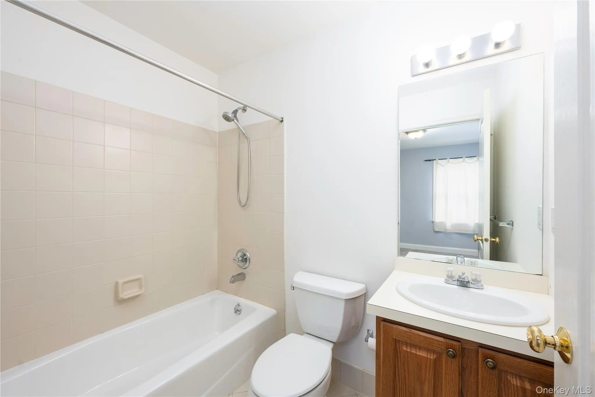 Bathroom with vanity and shower / bathtub combination Bathroom with vanity and shower / bathtub combination