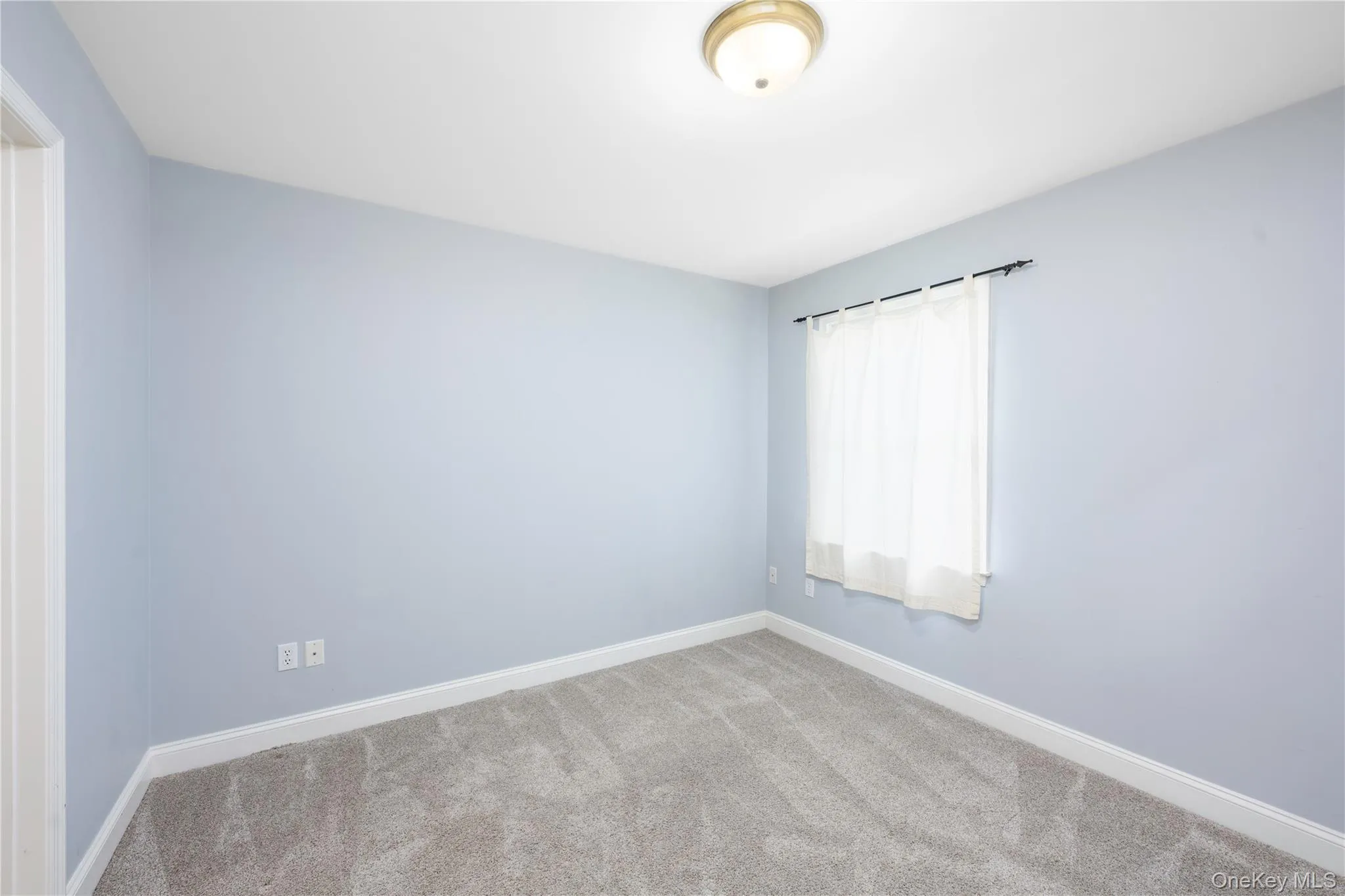 Spare room featuring carpet flooring Spare room featuring carpet flooring