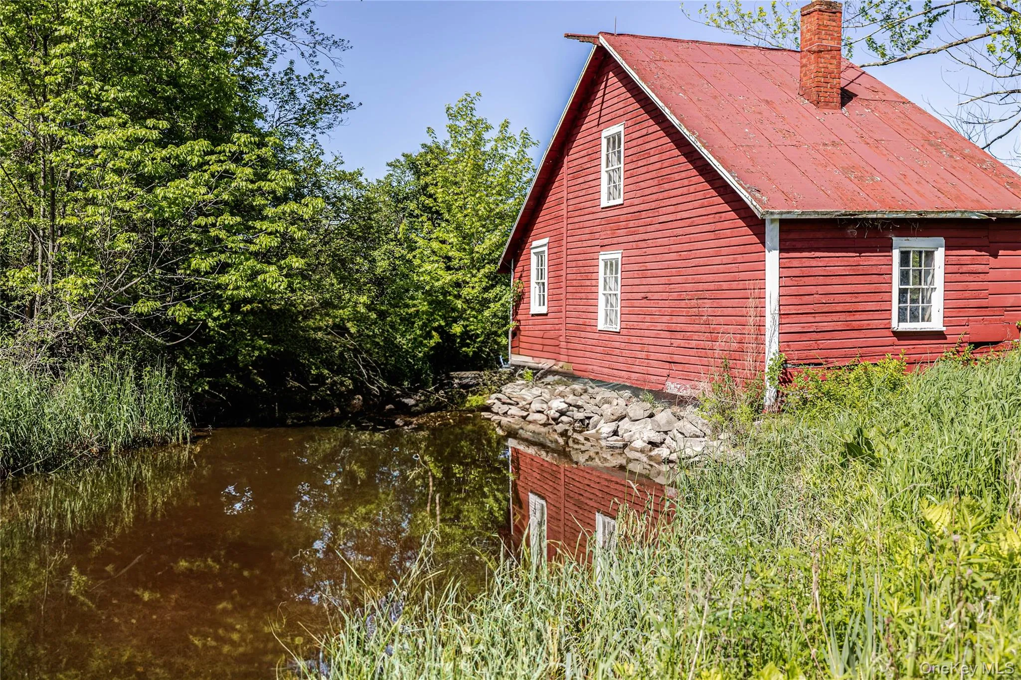 View of property exterior featuring a chimney View of property exterior featuring a chimney