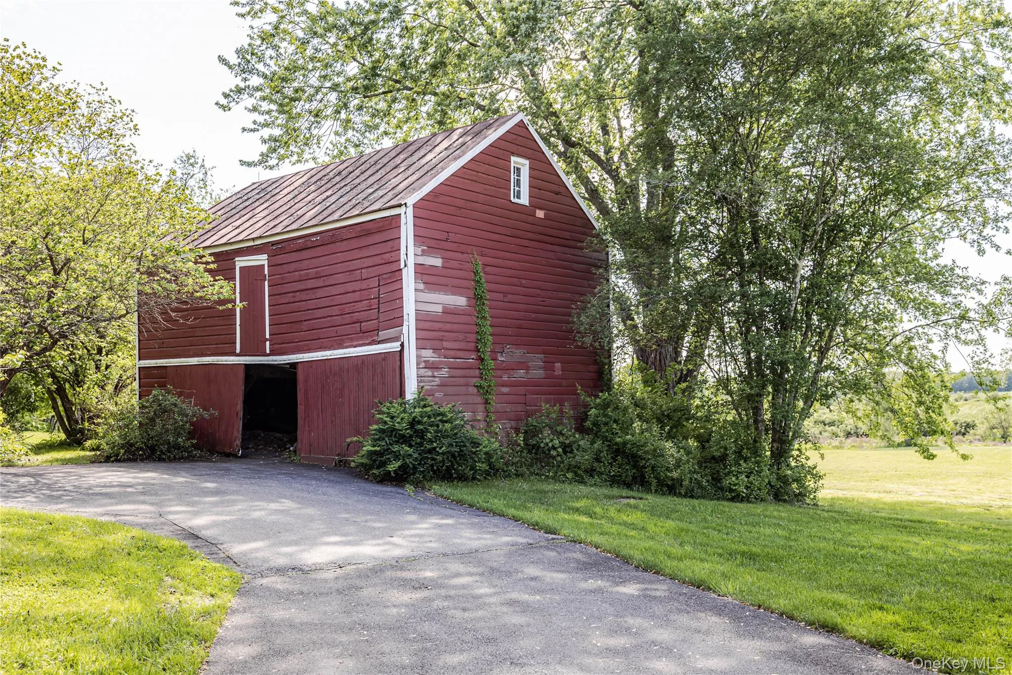 View of barn featuring a yard View of barn featuring a yard
