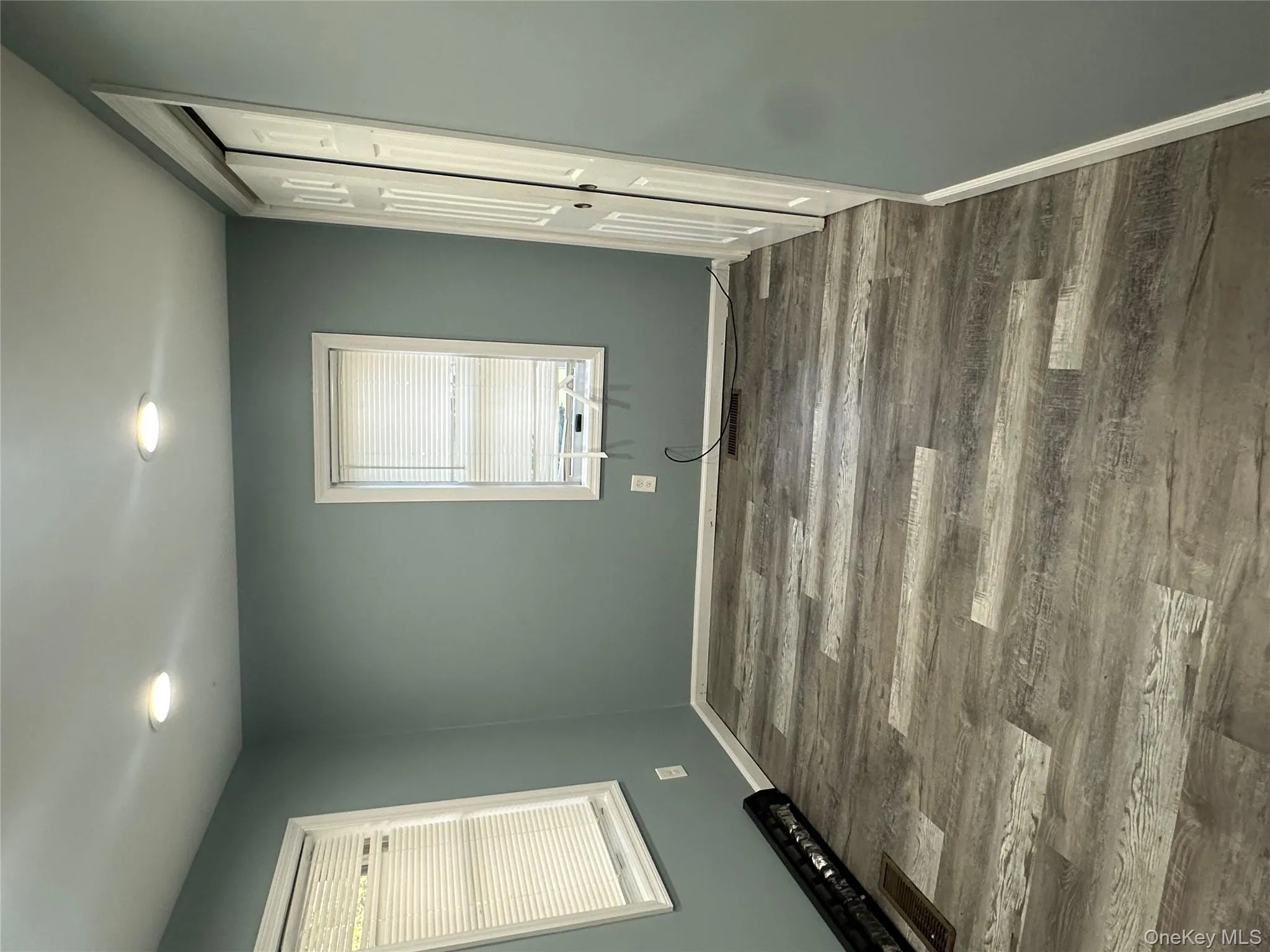 Unfurnished bedroom with dark wood finished floors, a closet, and recessed lighting Unfurnished bedroom with dark wood finished floors, a closet, and recessed lighting