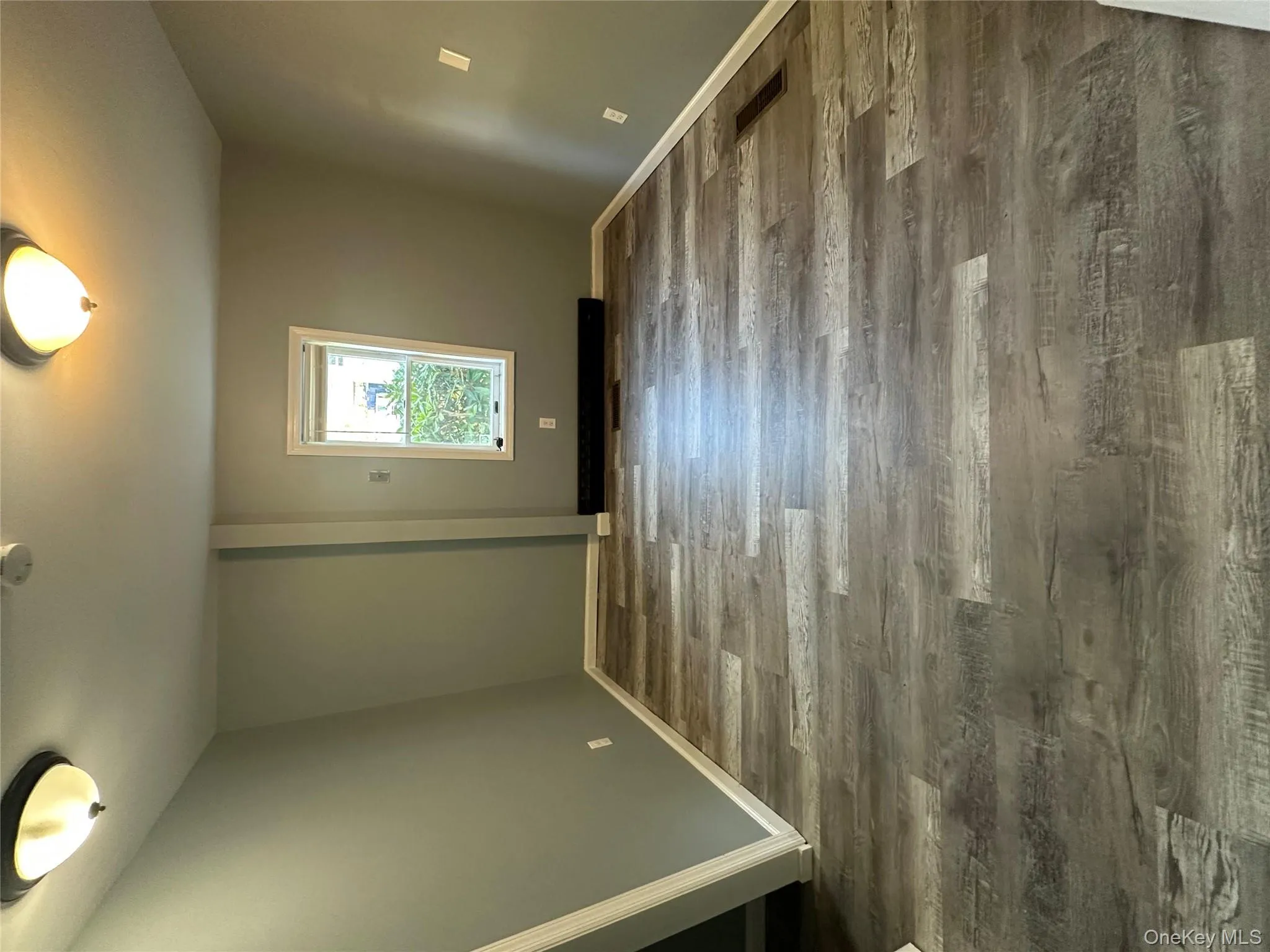 Empty room with wood finished floors and baseboards Empty room with wood finished floors and baseboards