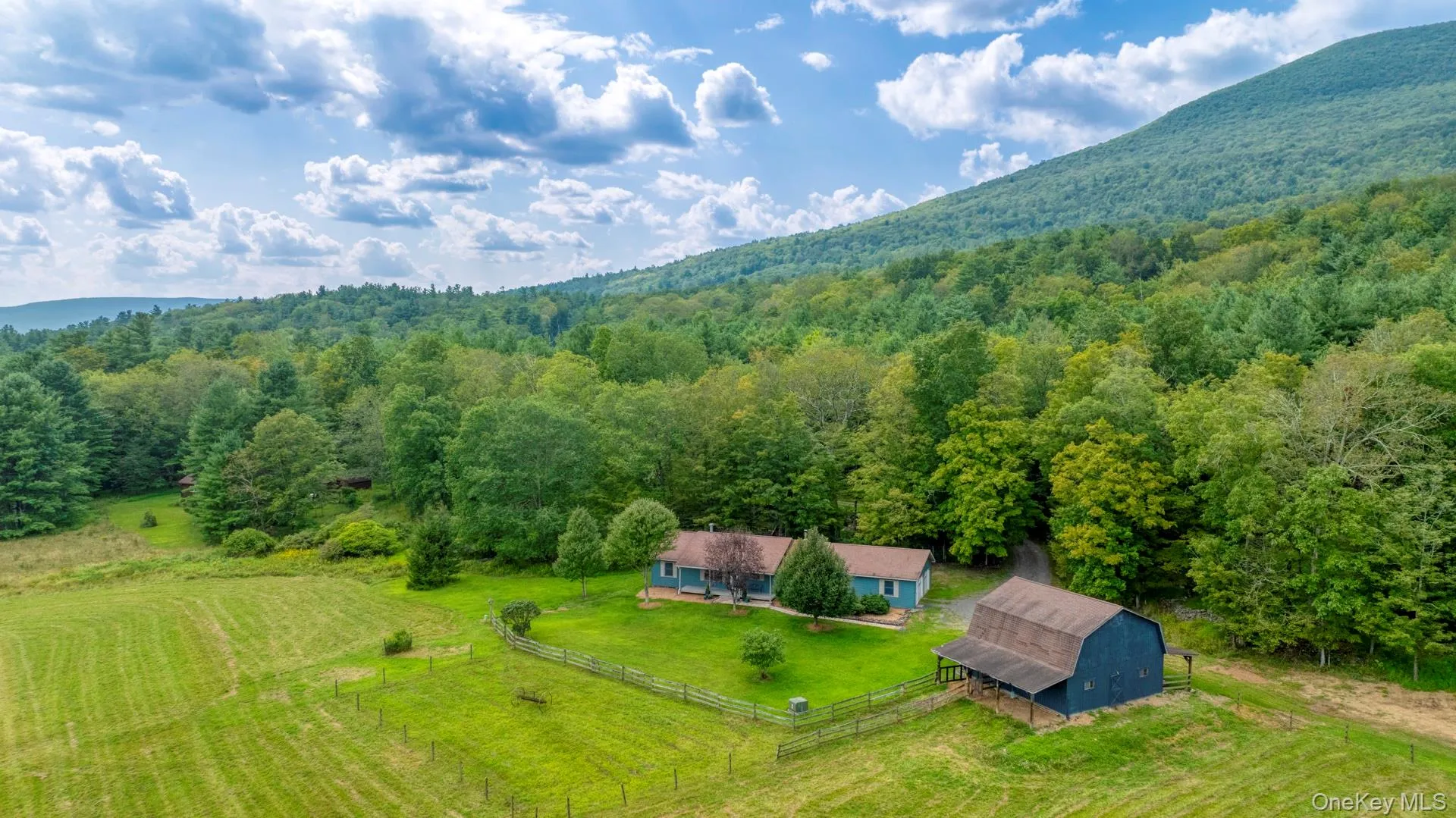 Aerial view of sparsely populated area with a heavily wooded area Aerial view of sparsely populated area with a heavily wooded area