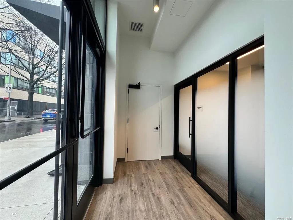 Hall featuring wood finished floors and baseboards Hall featuring wood finished floors and baseboards