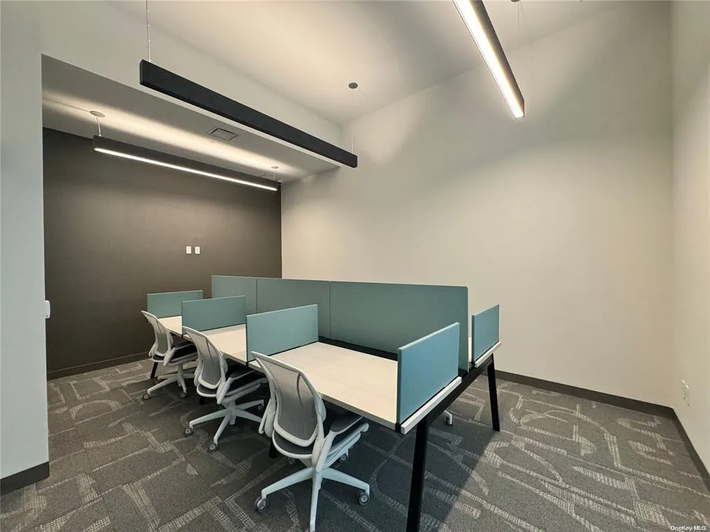 Office with dark colored carpet Office with dark colored carpet