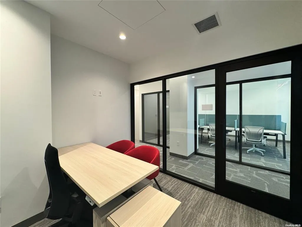 Dining area featuring dark colored carpet, recessed lighting, and baseboards Dining area featuring dark colored carpet, recessed lighting, and baseboards