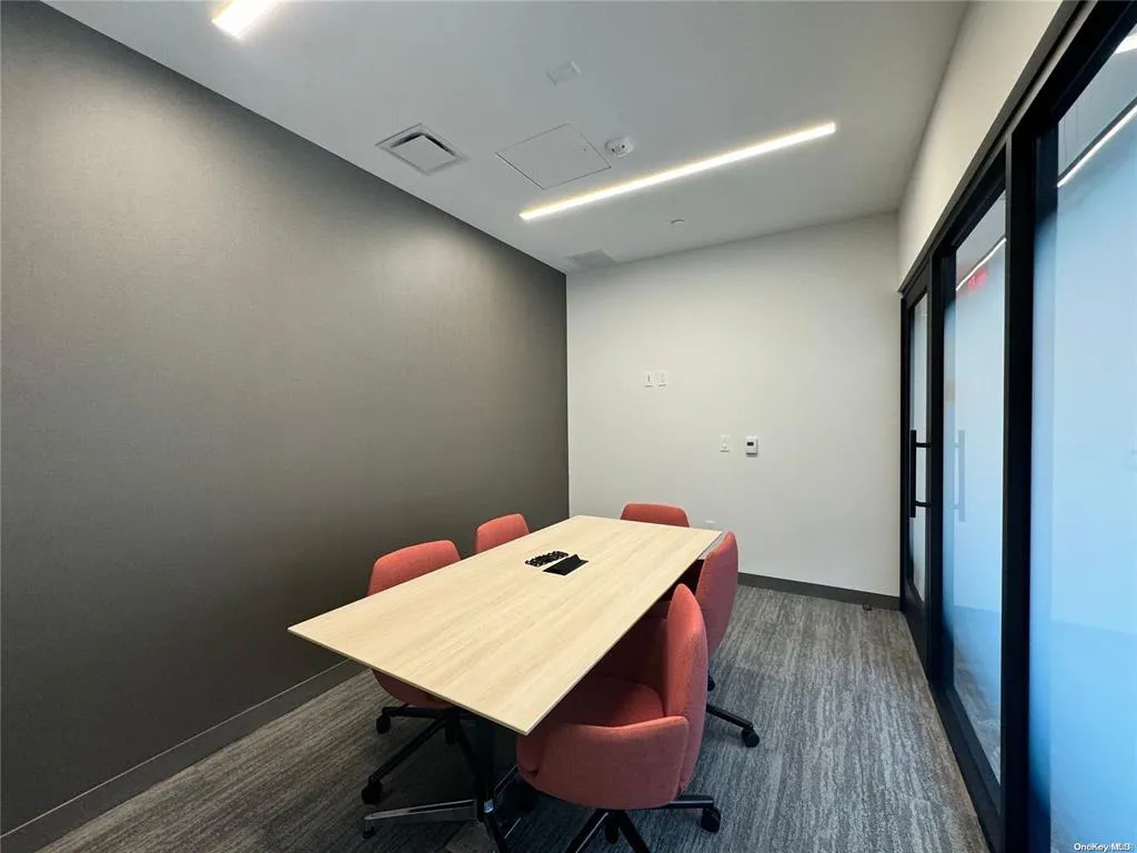 Office area with baseboards and plenty of natural light Office area with baseboards and plenty of natural light