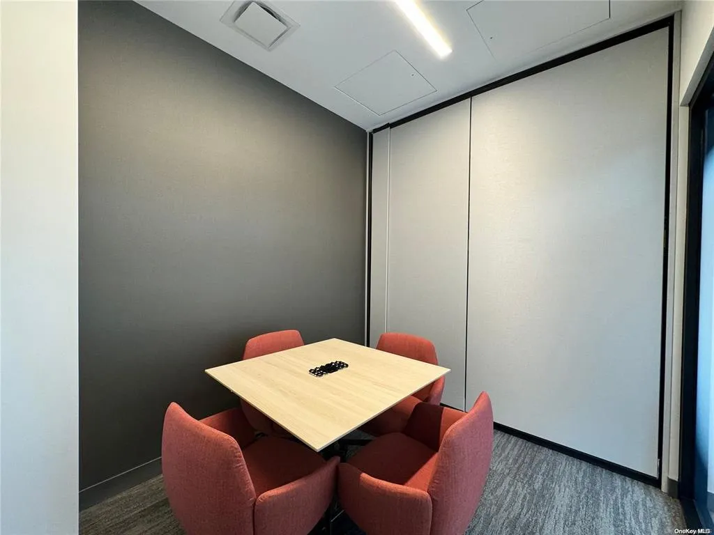Dining area featuring dark carpet and baseboards Dining area featuring dark carpet and baseboards