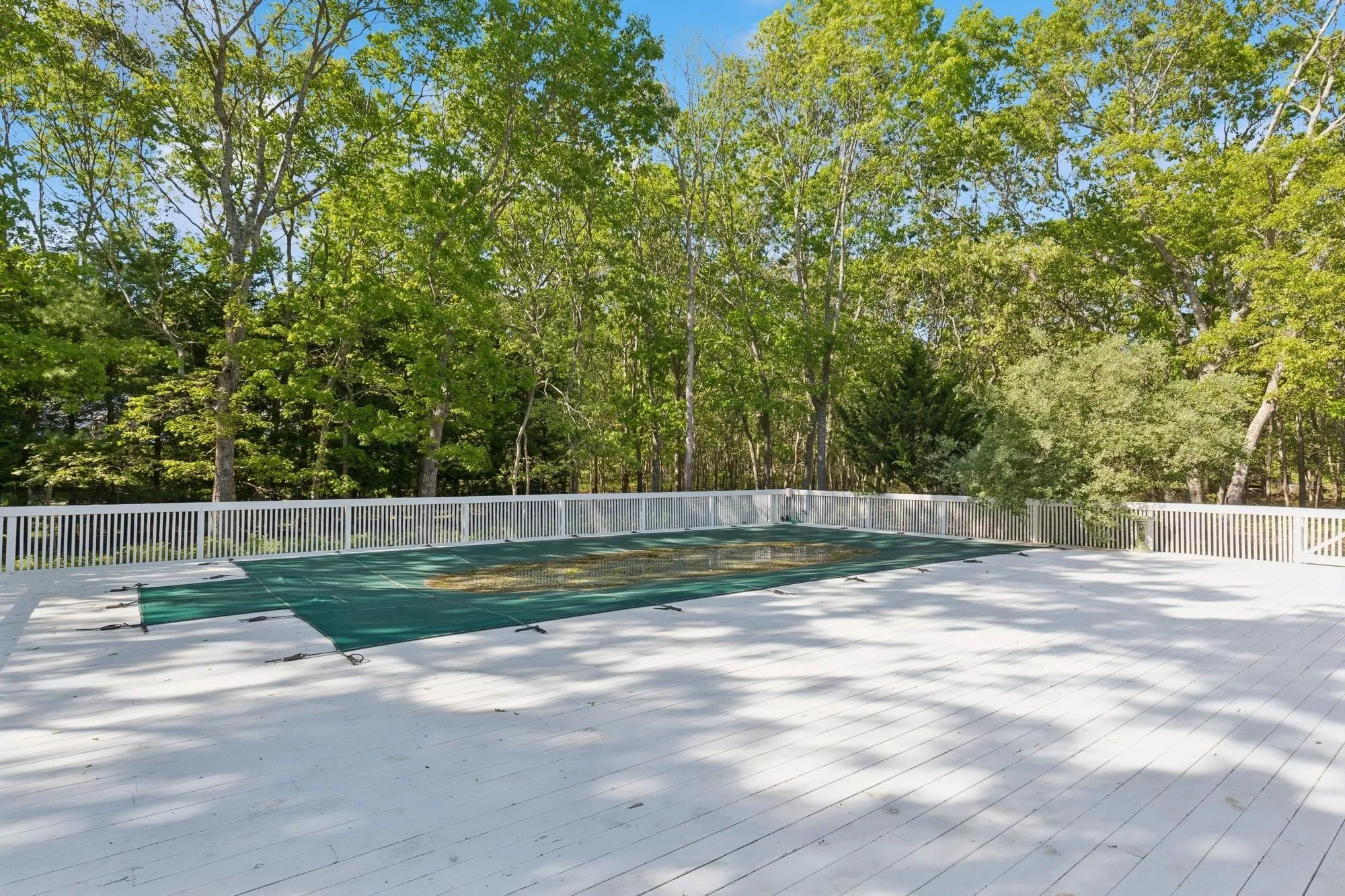 Wooden deck with view of wooded area Wooden deck with view of wooded area