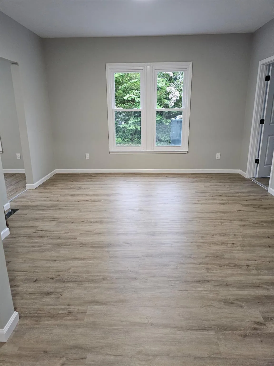 Empty room featuring baseboards and wood finished floors Empty room featuring baseboards and wood finished floors