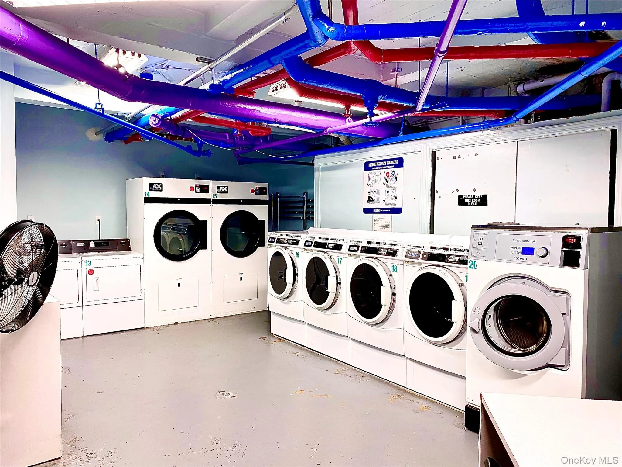 Shared laundry featuring washing machine and clothes dryer Shared laundry featuring washing machine and clothes dryer