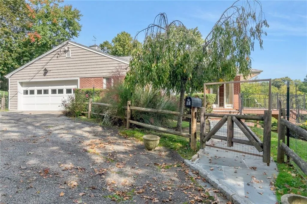 View of front of house with brick siding and driveway View of front of house with brick siding and driveway