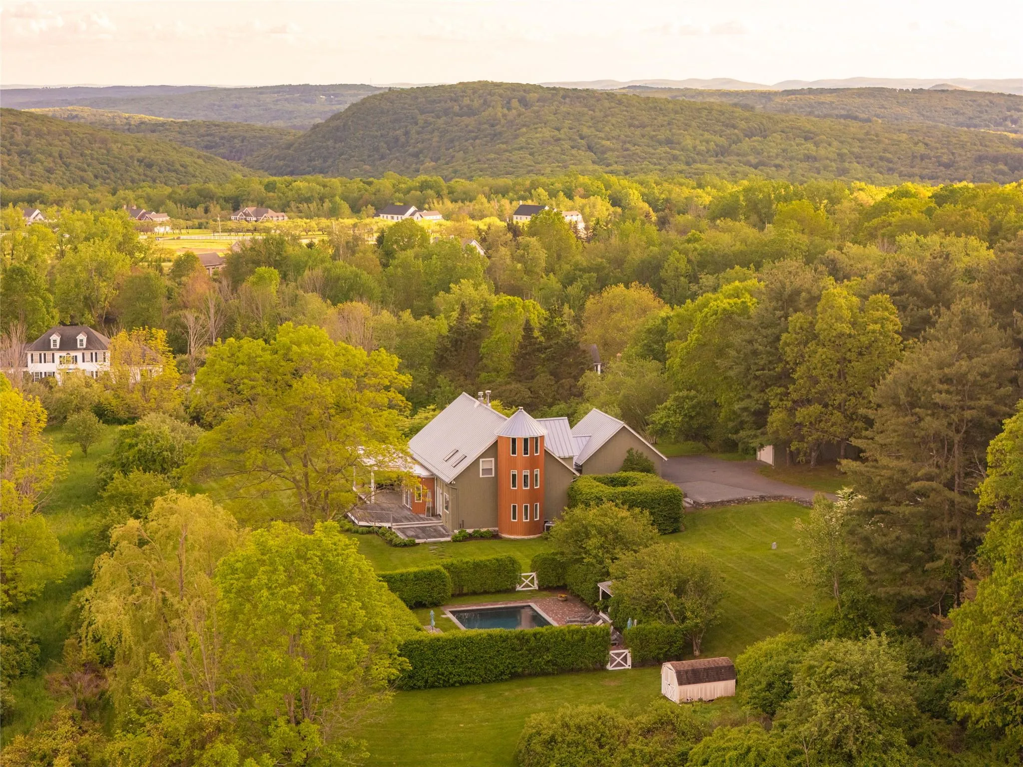 View from above of property with a forest and a mountain backdrop View from above of property with a forest and a mountain backdrop