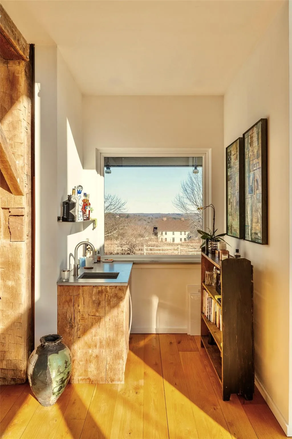 Bar with a sink and hardwood / wood-style floors Bar with a sink and hardwood / wood-style floors