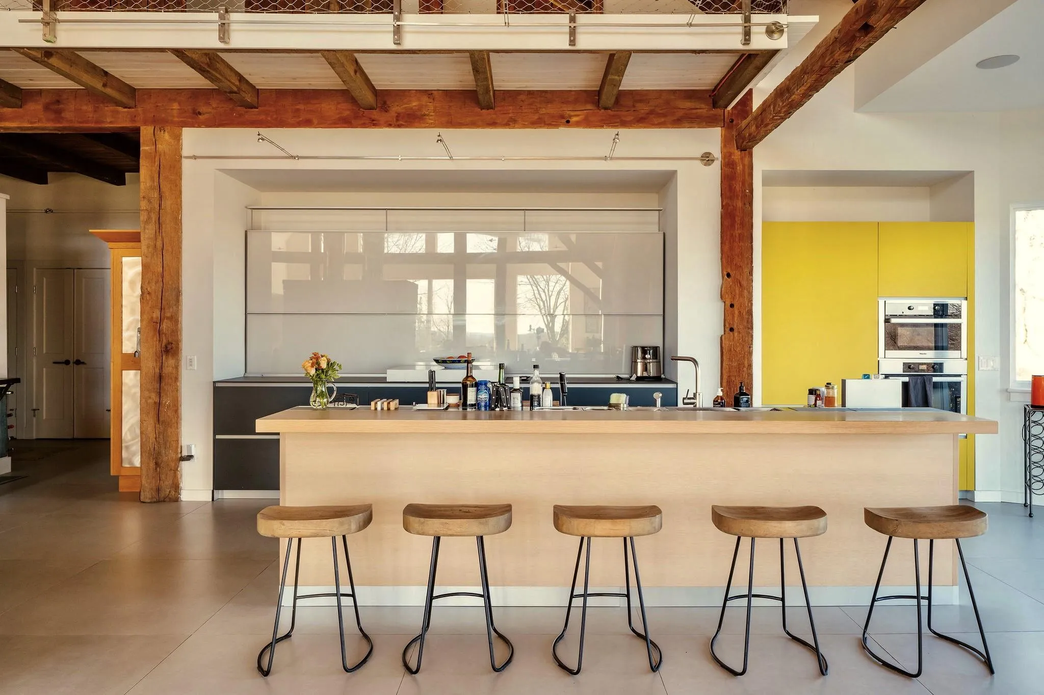 Bar with beam ceiling, double oven, and a sink Bar with beam ceiling, double oven, and a sink