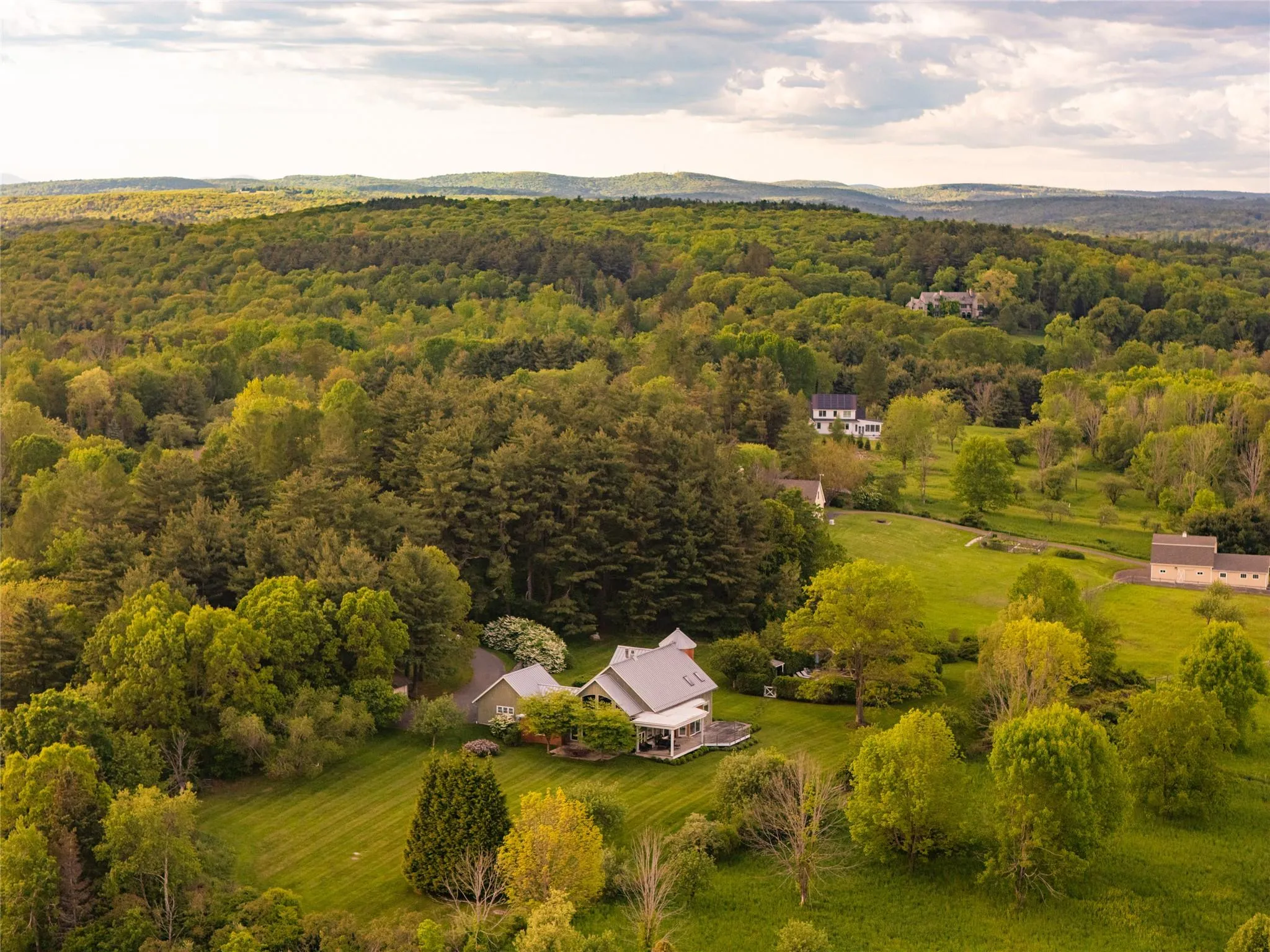 View of subject property featuring a heavily wooded area View of subject property featuring a heavily wooded area