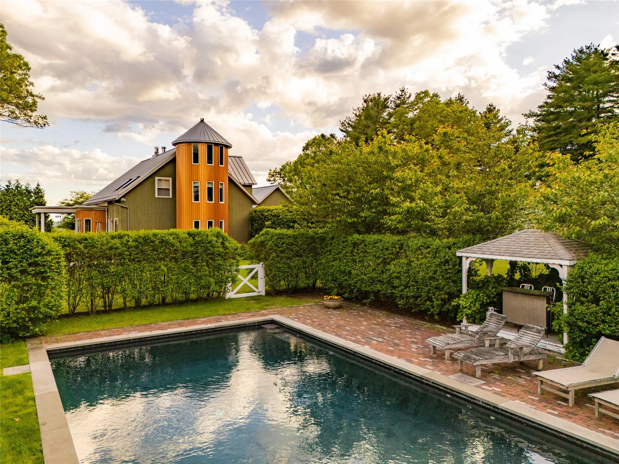 View of swimming pool featuring a gazebo and a patio View of swimming pool featuring a gazebo and a patio