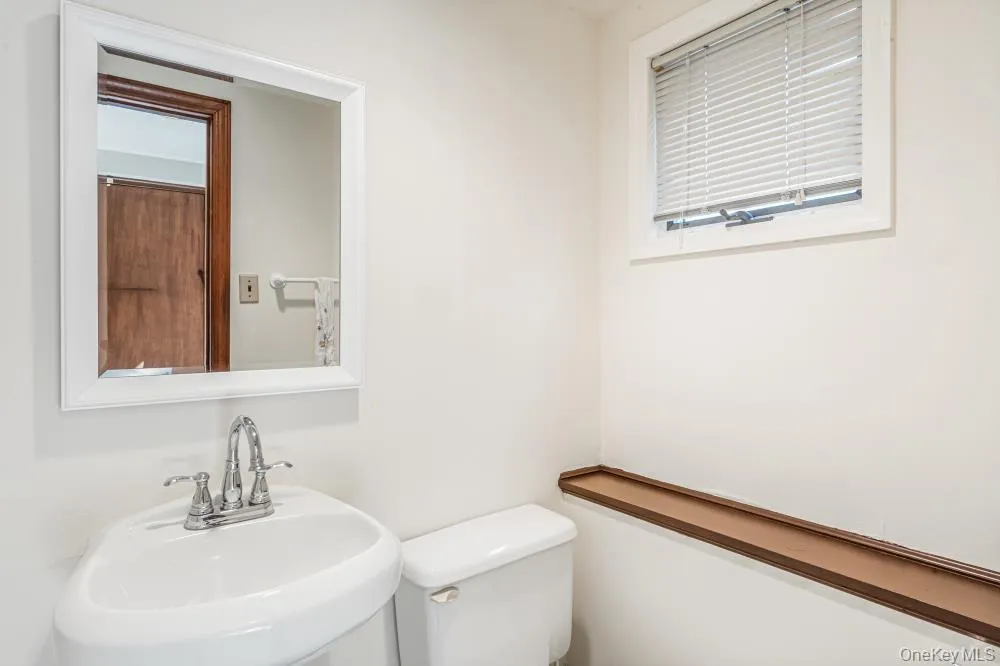 Bathroom featuring a sink and toilet Bathroom featuring a sink and toilet