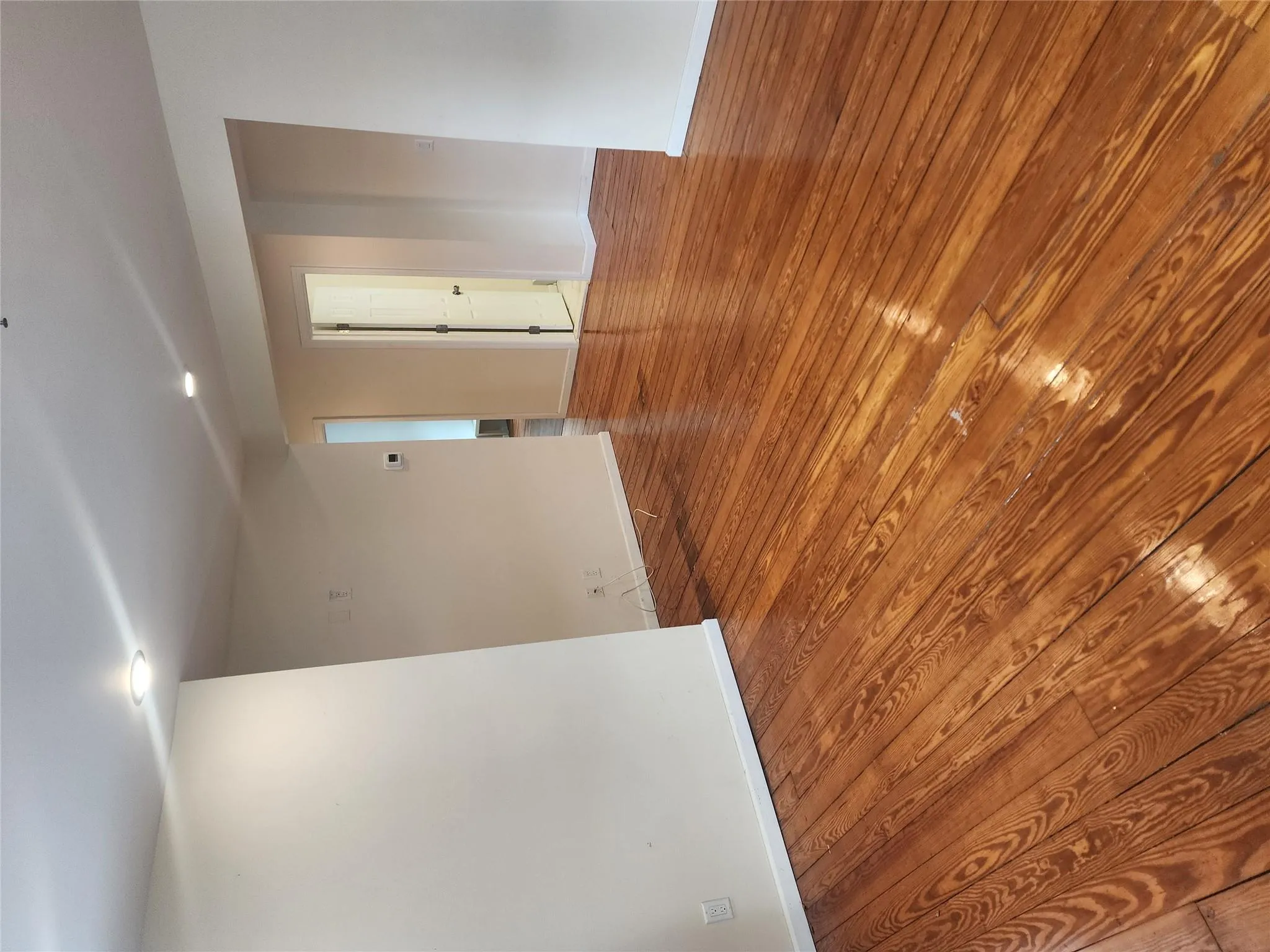 Empty room featuring hardwood / wood-style floors and recessed lighting Empty room featuring hardwood / wood-style floors and recessed lighting