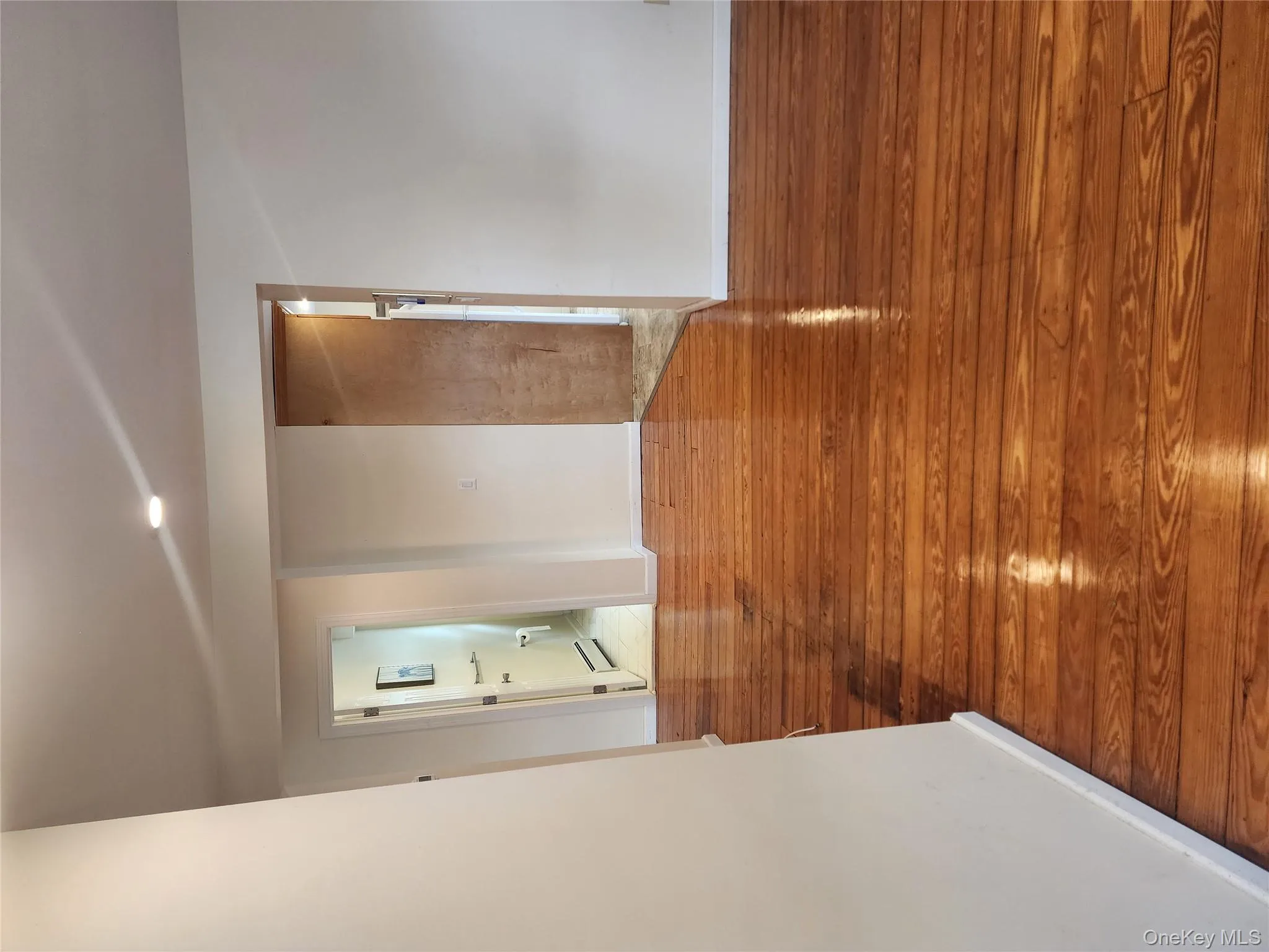 Spare room with wood-type flooring, baseboard heating, and recessed lighting Spare room with wood-type flooring, baseboard heating, and recessed lighting