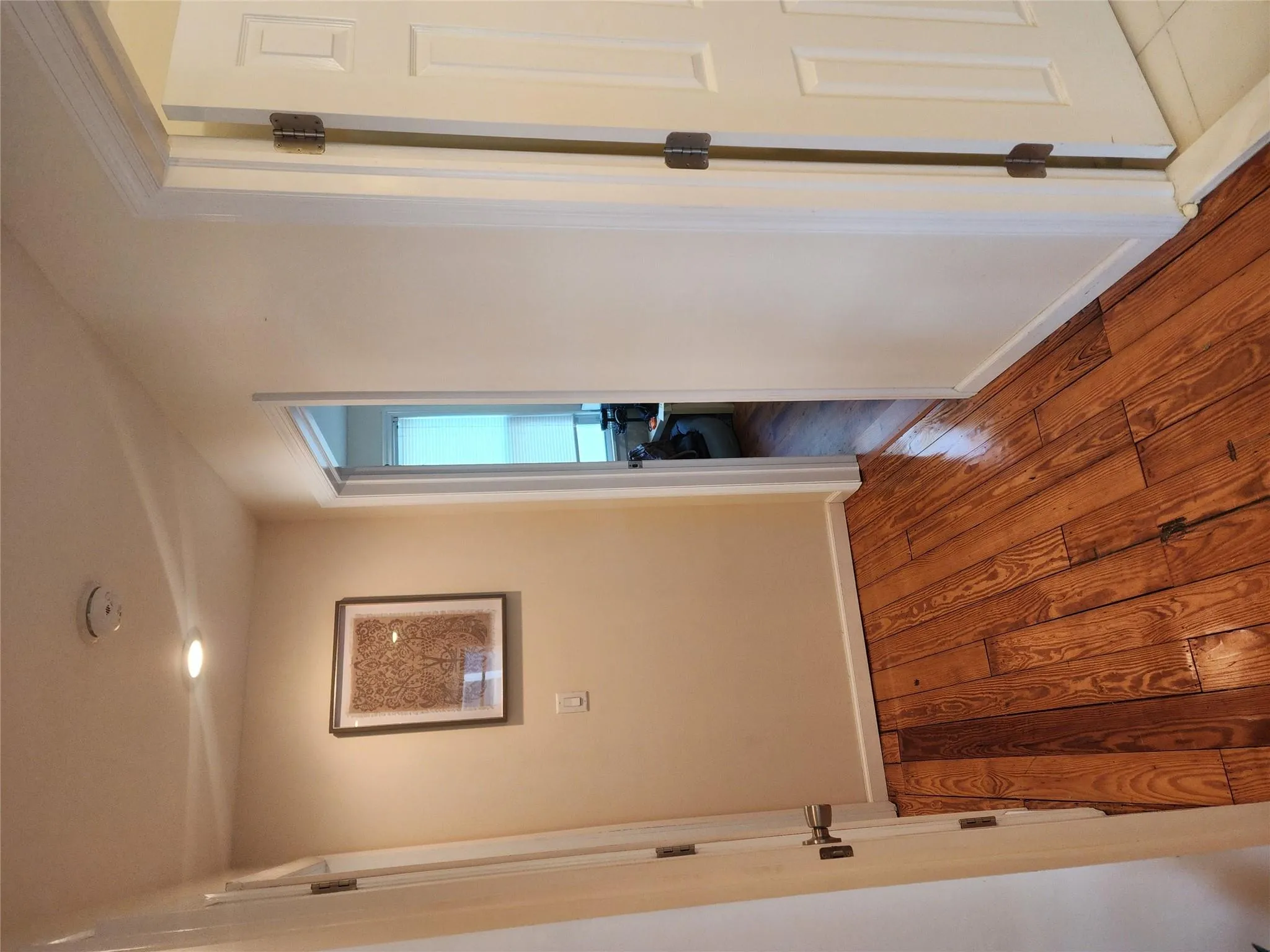 Corridor with wood finished floors and baseboards Corridor with wood finished floors and baseboards
