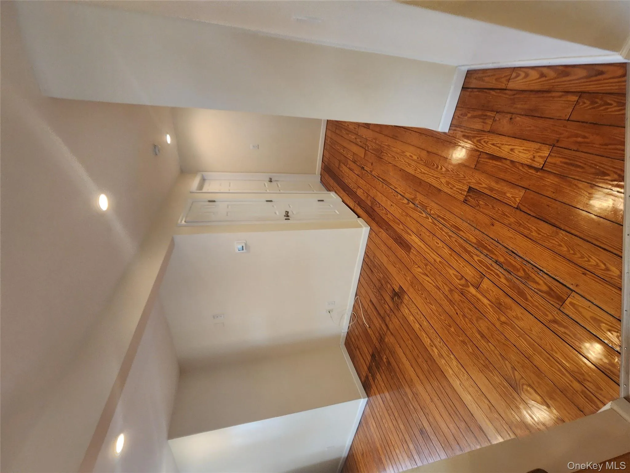 Spare room featuring hardwood / wood-style floors and recessed lighting Spare room featuring hardwood / wood-style floors and recessed lighting