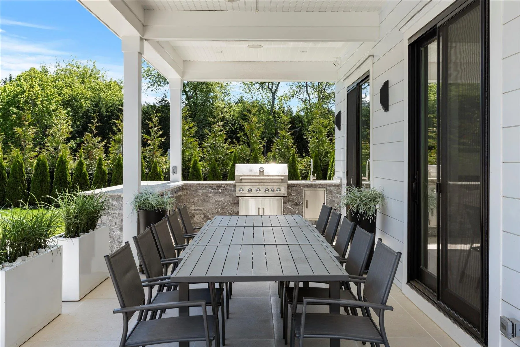 View of patio / terrace with outdoor dining area and a grill View of patio / terrace with outdoor dining area and a grill
