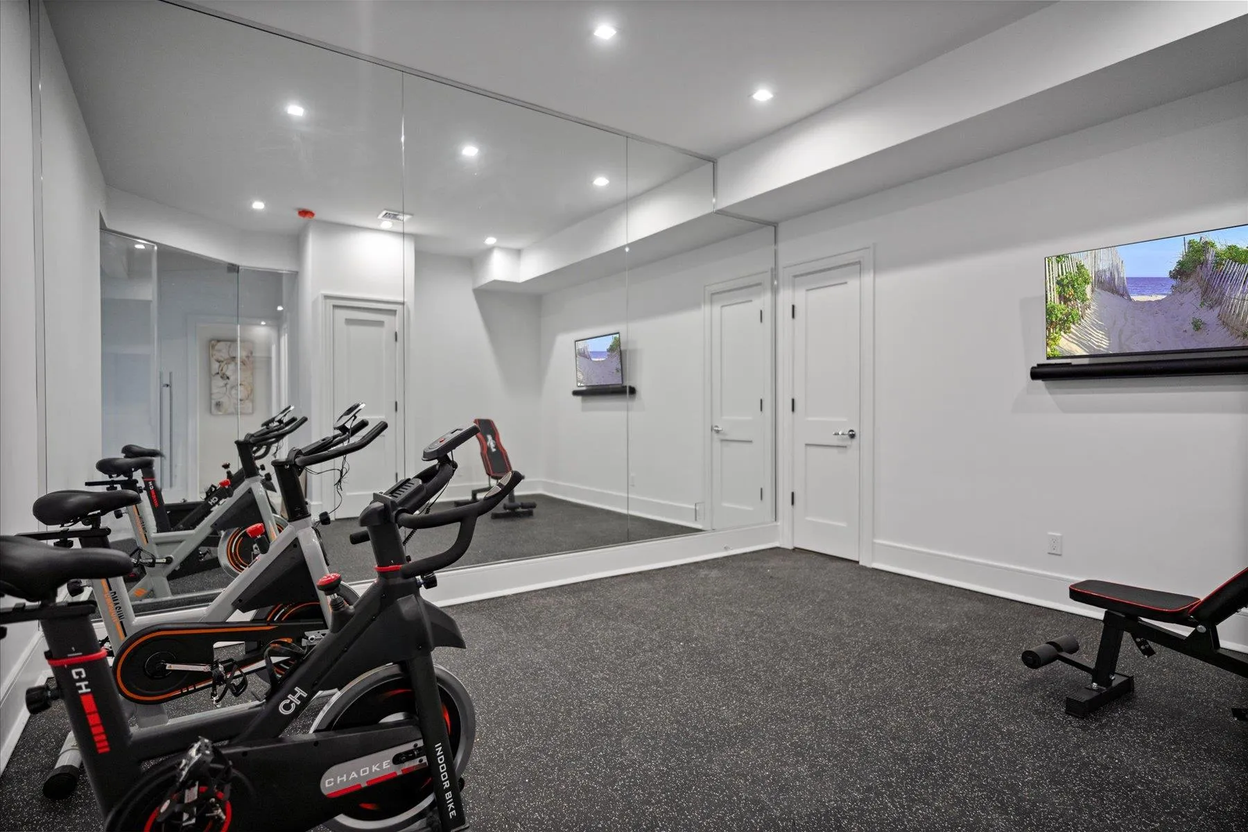 Exercise room featuring recessed lighting and baseboards Exercise room featuring recessed lighting and baseboards