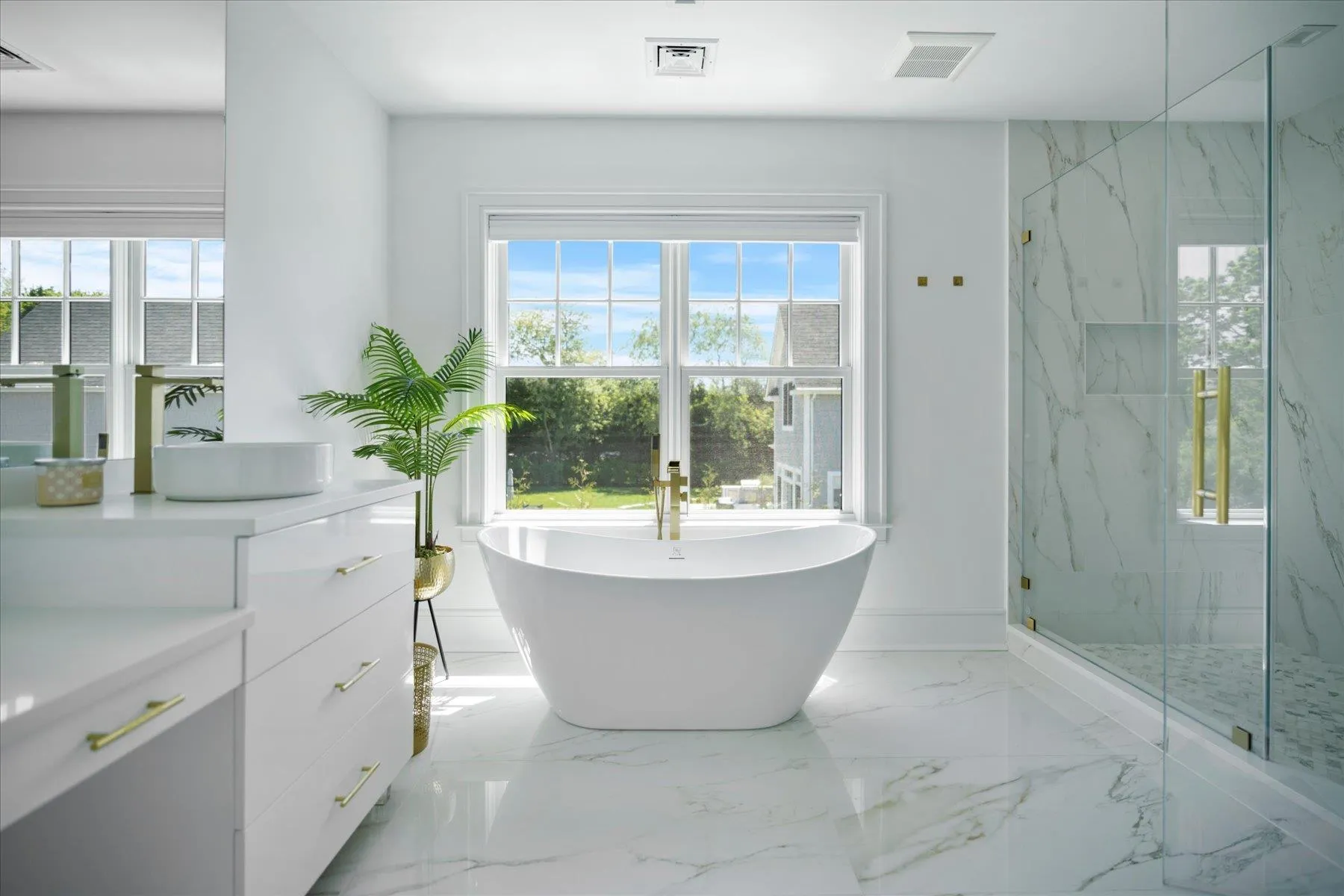 Bathroom with plenty of natural light, vanity, a soaking tub, and a marble finish shower Bathroom with plenty of natural light, vanity, a soaking tub, and a marble finish shower