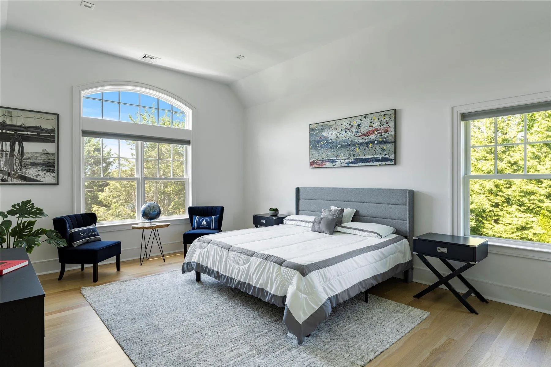 Bedroom with vaulted ceiling, wood finished floors, and baseboards Bedroom with vaulted ceiling, wood finished floors, and baseboards