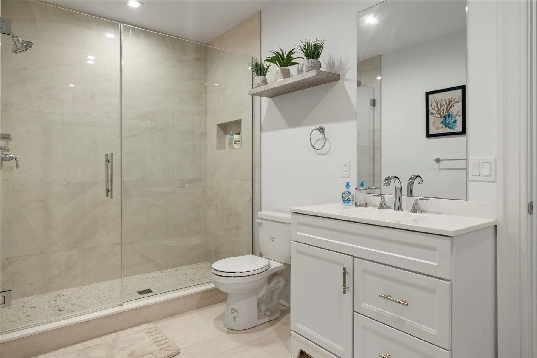 Full bath featuring vanity, toilet, a shower stall, recessed lighting, and tile patterned floors Full bath featuring vanity, toilet, a shower stall, recessed lighting, and tile patterned floors