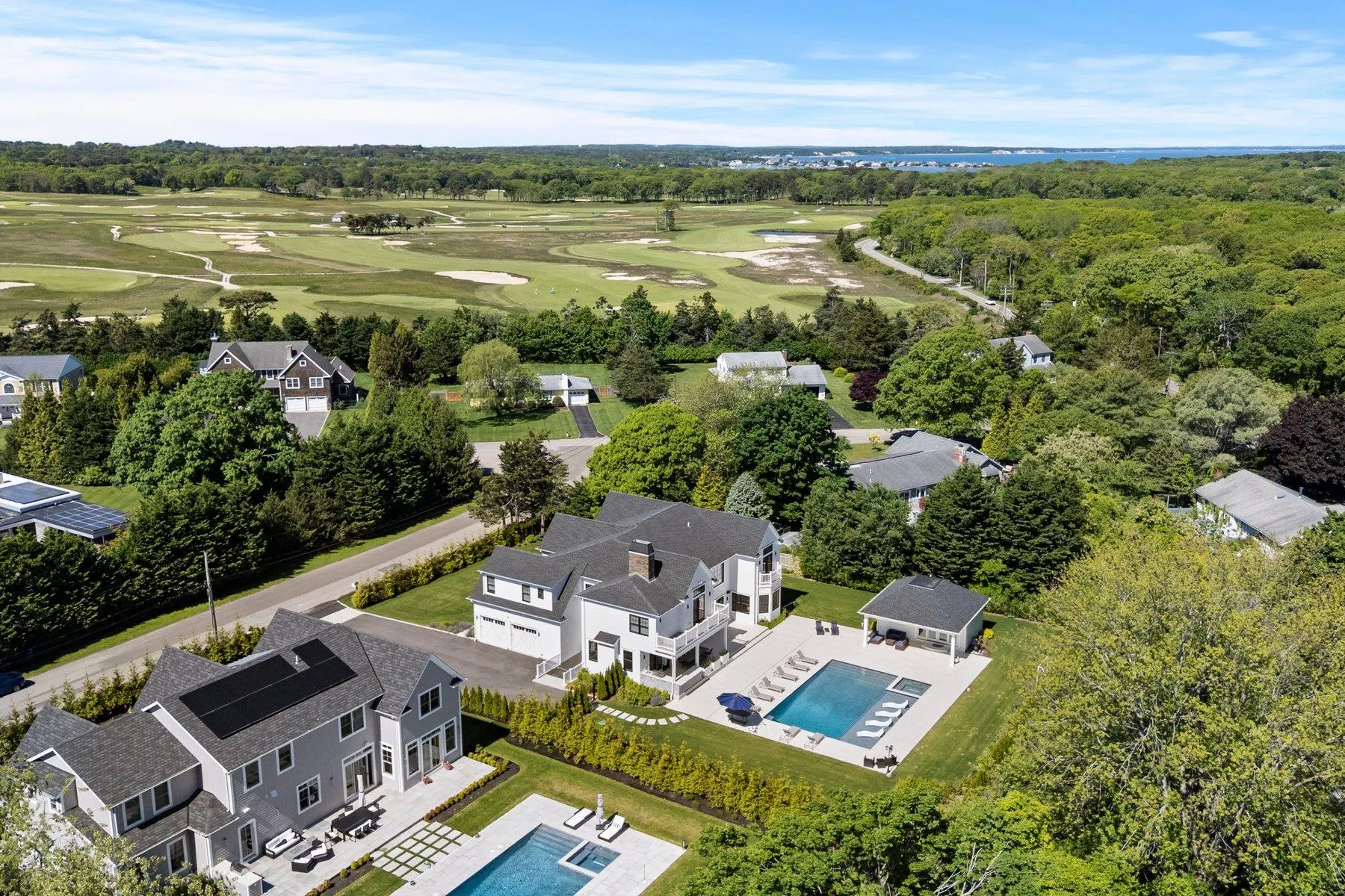 Drone / aerial view of a pool area and a local golf course Drone / aerial view of a pool area and a local golf course