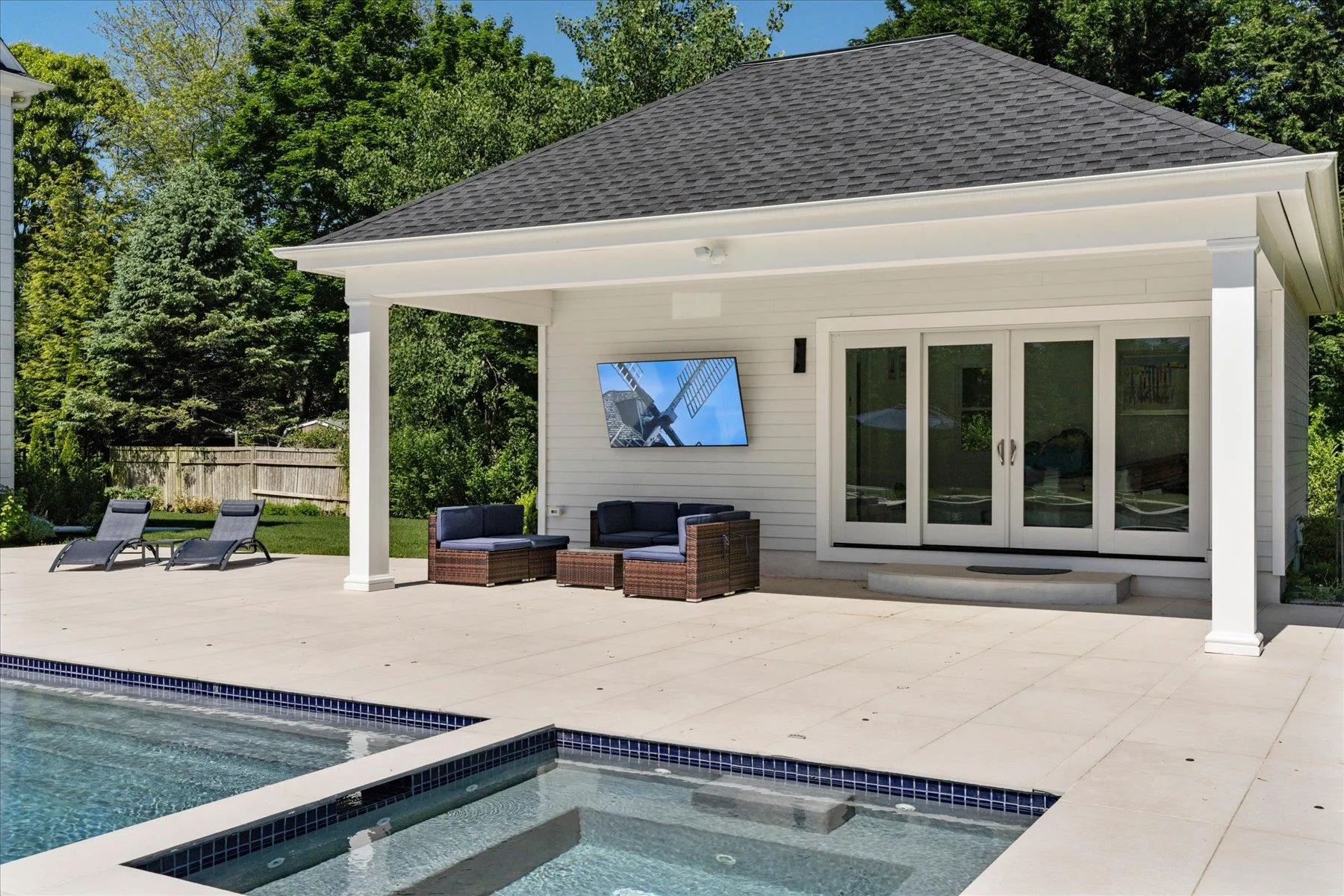 View of swimming pool with french doors, an outdoor living space, a patio, and a pool with connected hot tub View of swimming pool with french doors, an outdoor living space, a patio, and a pool with connected hot tub
