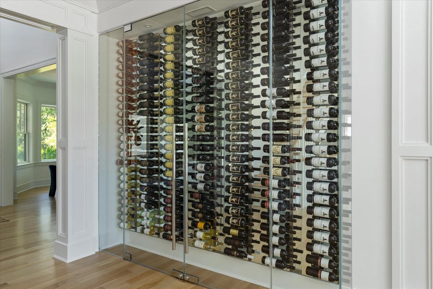 Wine cellar featuring light wood-type flooring Wine cellar featuring light wood-type flooring