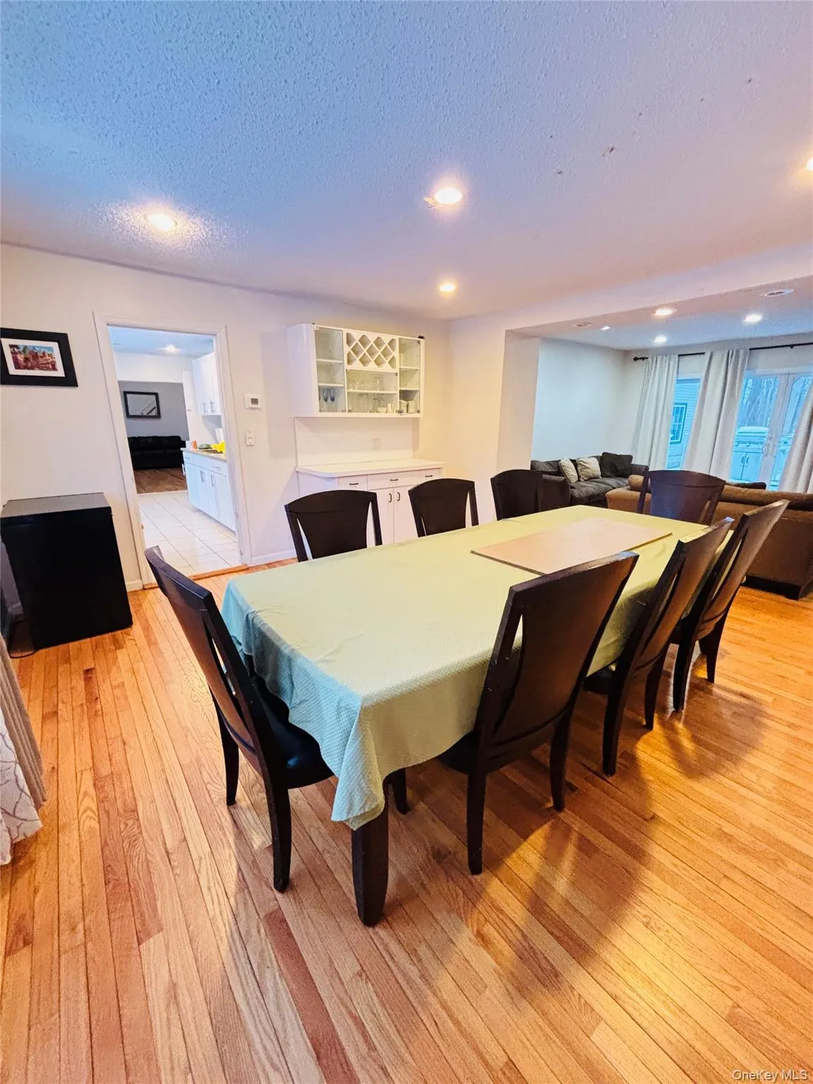 Massive size dining room joins a comfy family room at the rear which opens on to a nice deck for outdoor entertaining and grilling. Massive size dining room joins a comfy family room at the rear which opens on to a nice deck for outdoor entertaining and grilling.