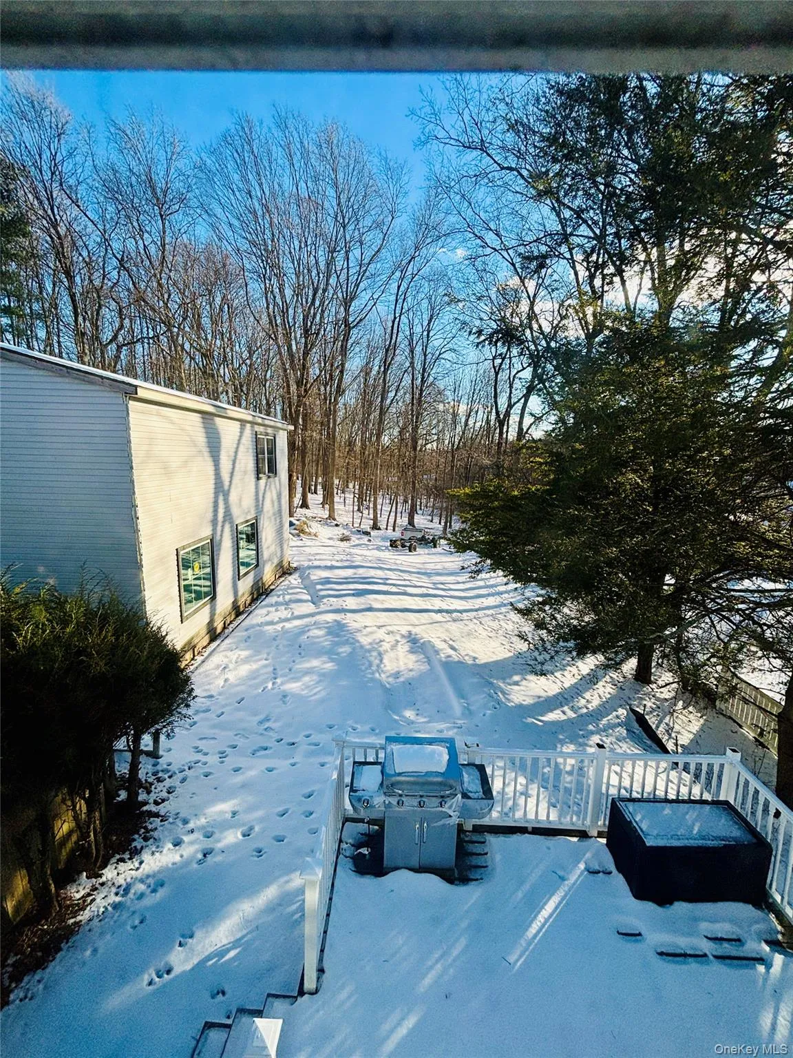 Snowy yard with a deck Snowy yard with a deck
